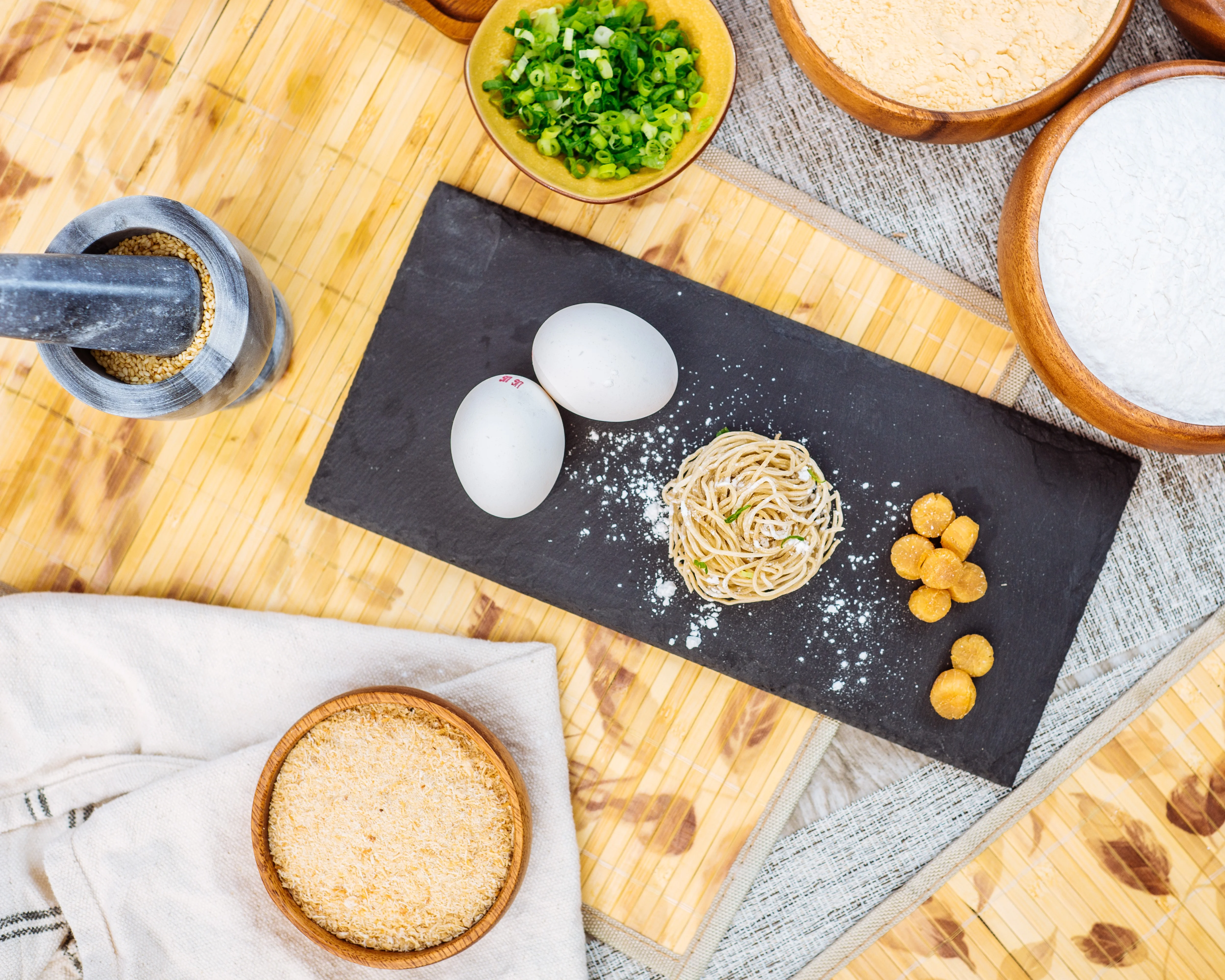 Ingredients for making Chinese noodles on a slate board