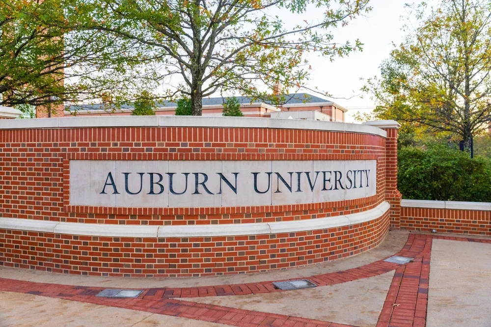 Auburn University entrance sign with brickwork and trees