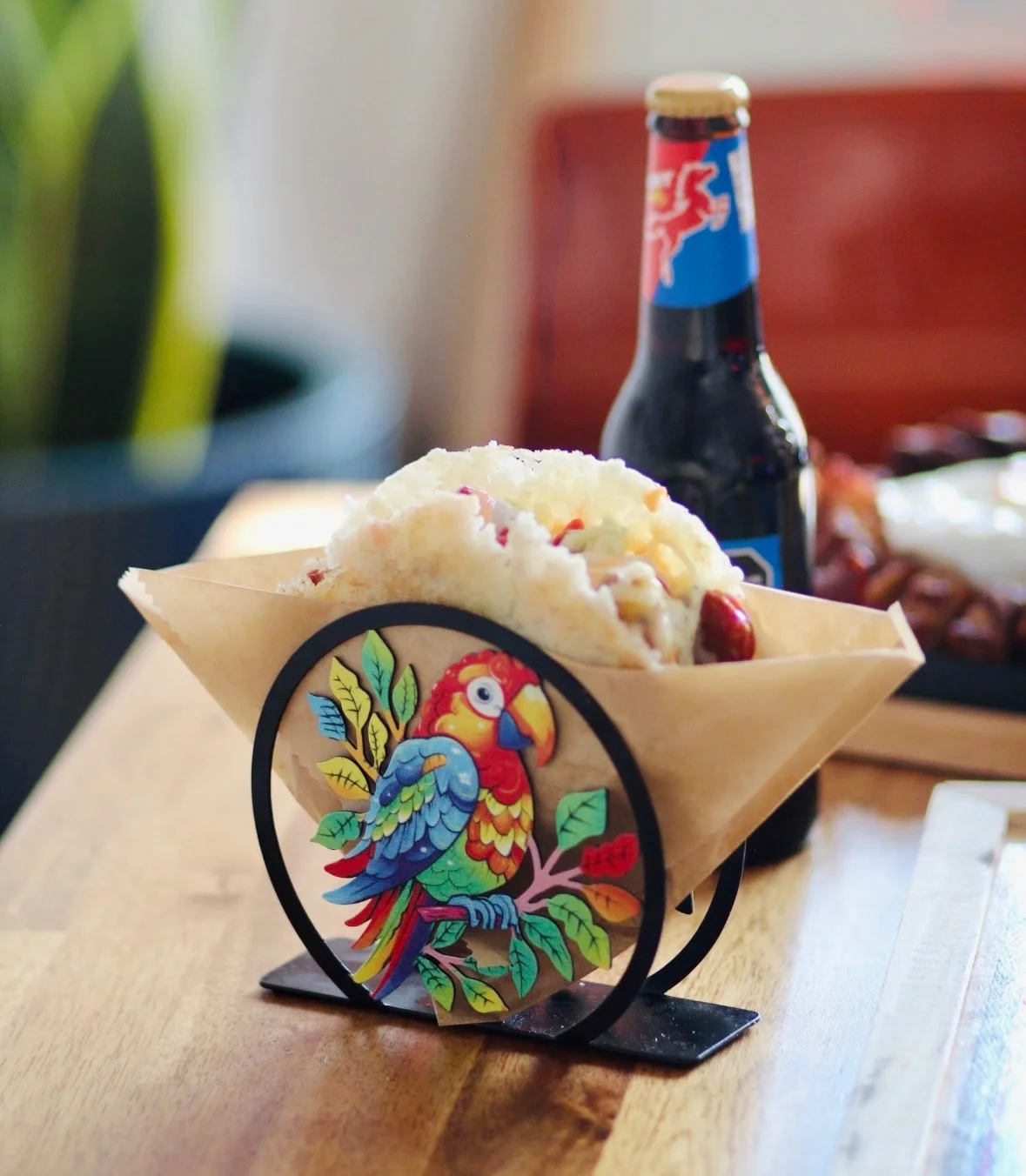 Colorful taco served in a decorative holder