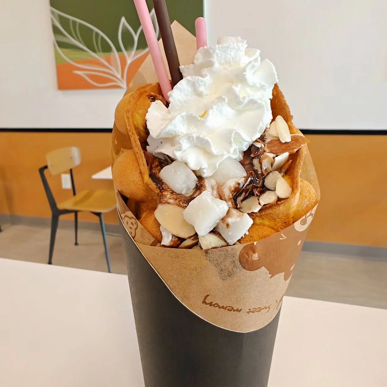 Hong Kong-style egg waffle dessert with whipped cream
