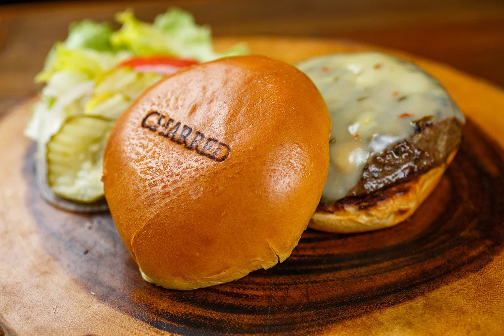 Juicy cheeseburger with toasted bun and fresh toppings