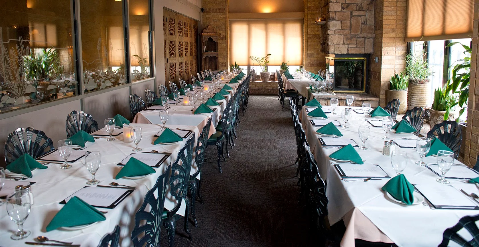 Elegant restaurant interior with long tables and green napkins
