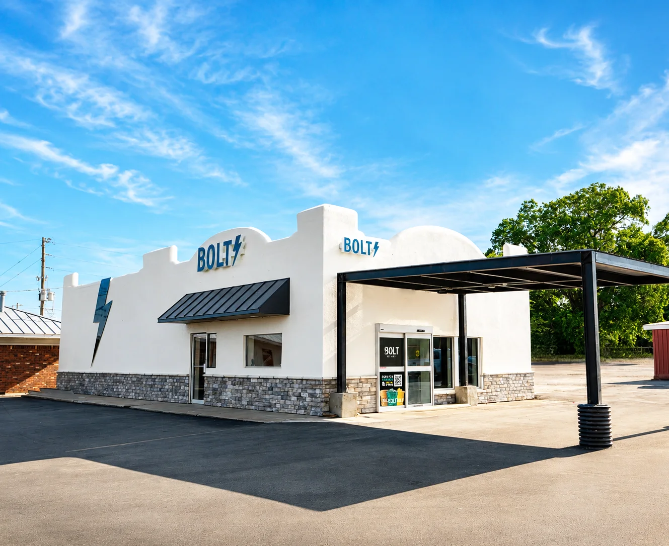 Exterior view of BOLT restaurant with modern design and clear blue sky.