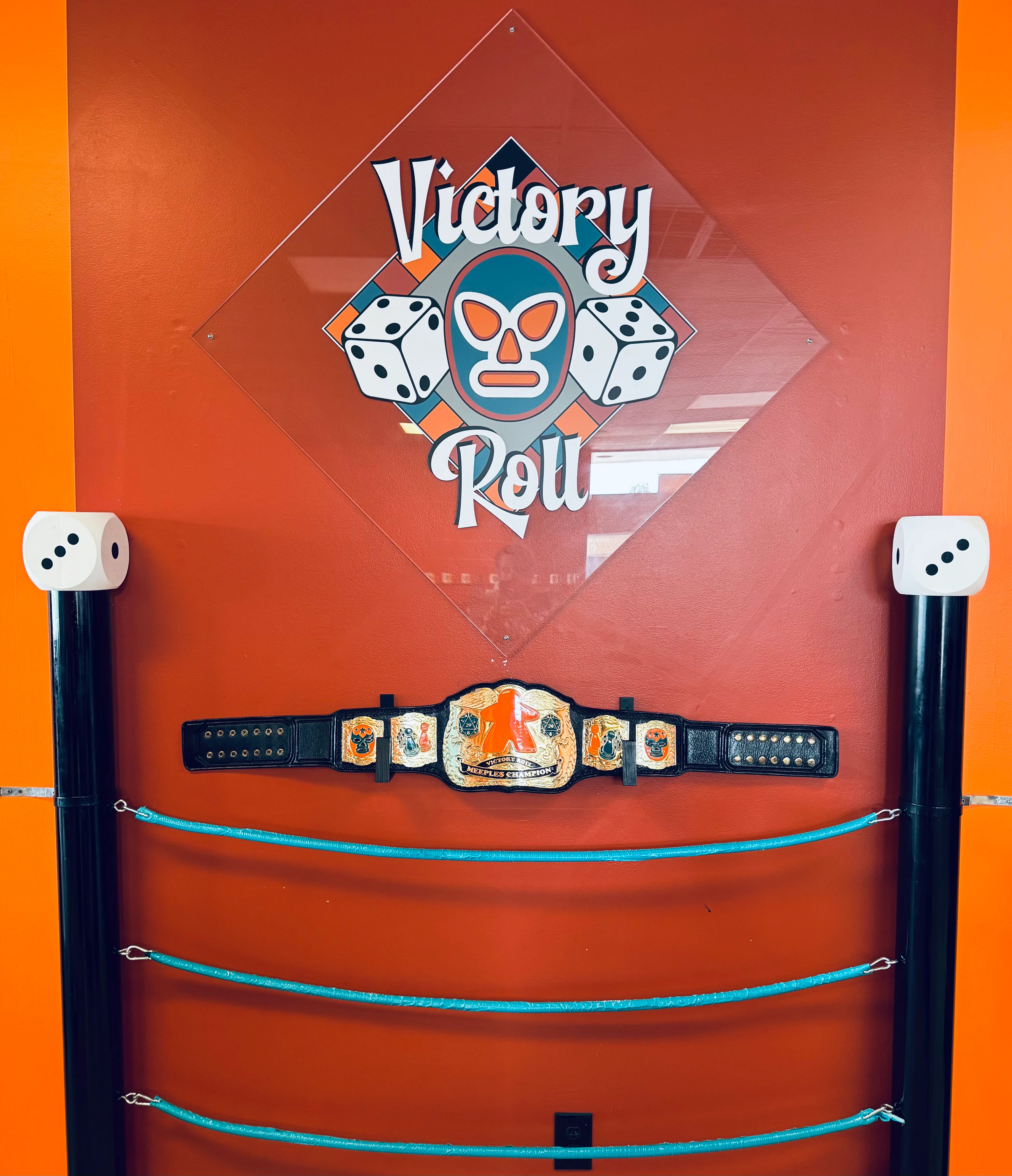Victory Roll restaurant decor with championship belt and dice