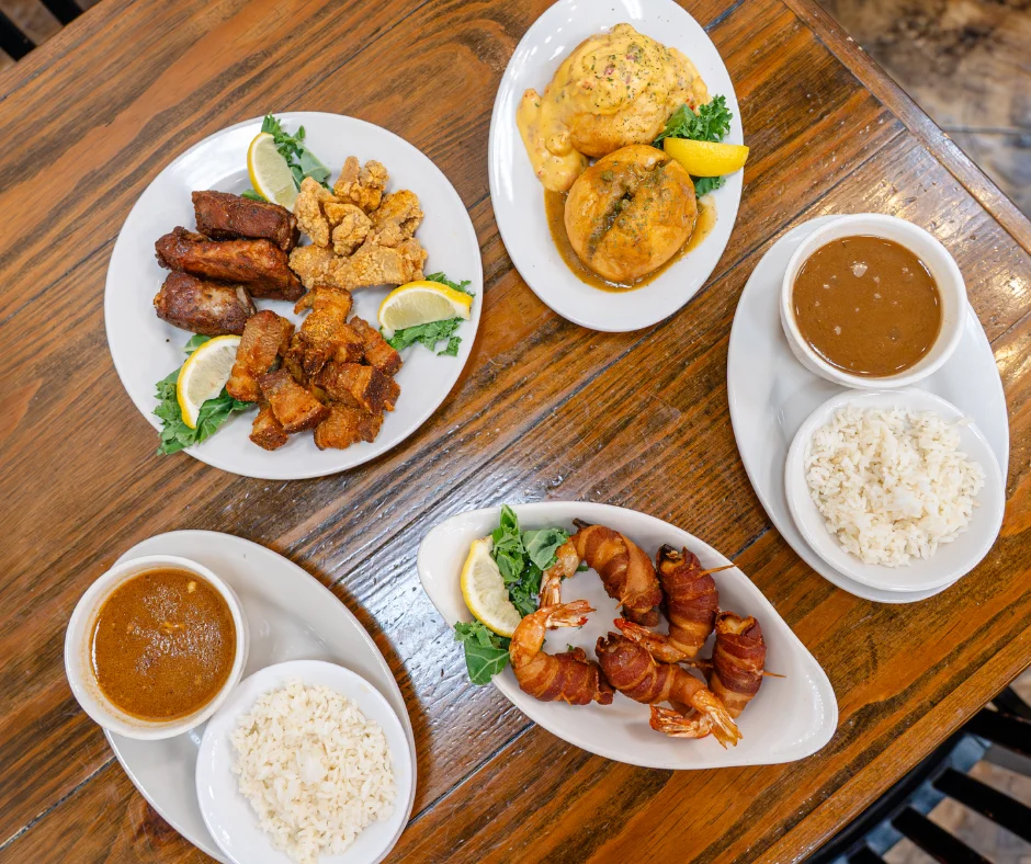 Assorted Caribbean dishes including fried plantains and shrimp.