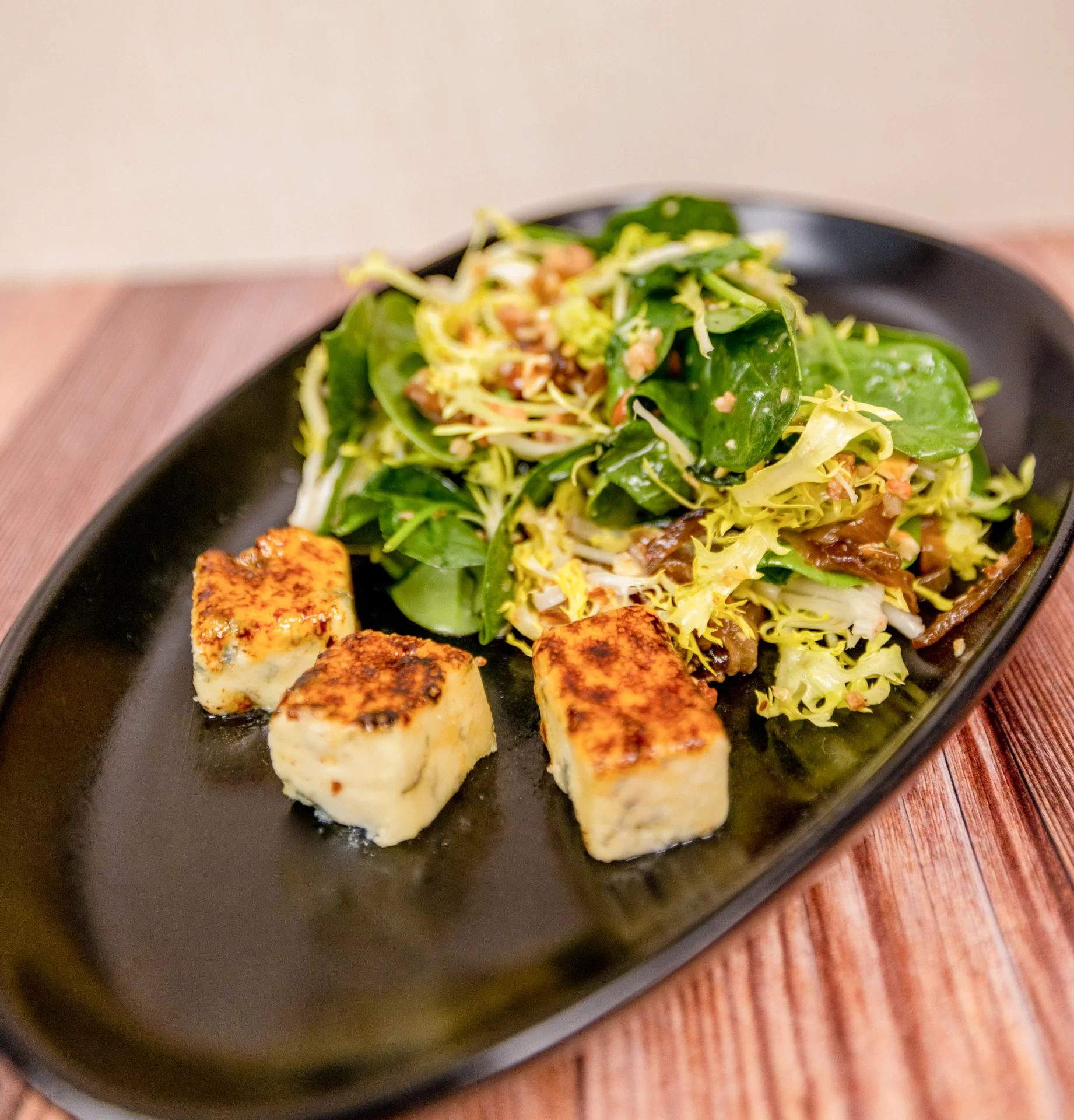 Spinach and Blue Cheese Salad frisée, rogue river smoked blue cheese, hazelnuts, caramelized shallot, bacon vinaigrette