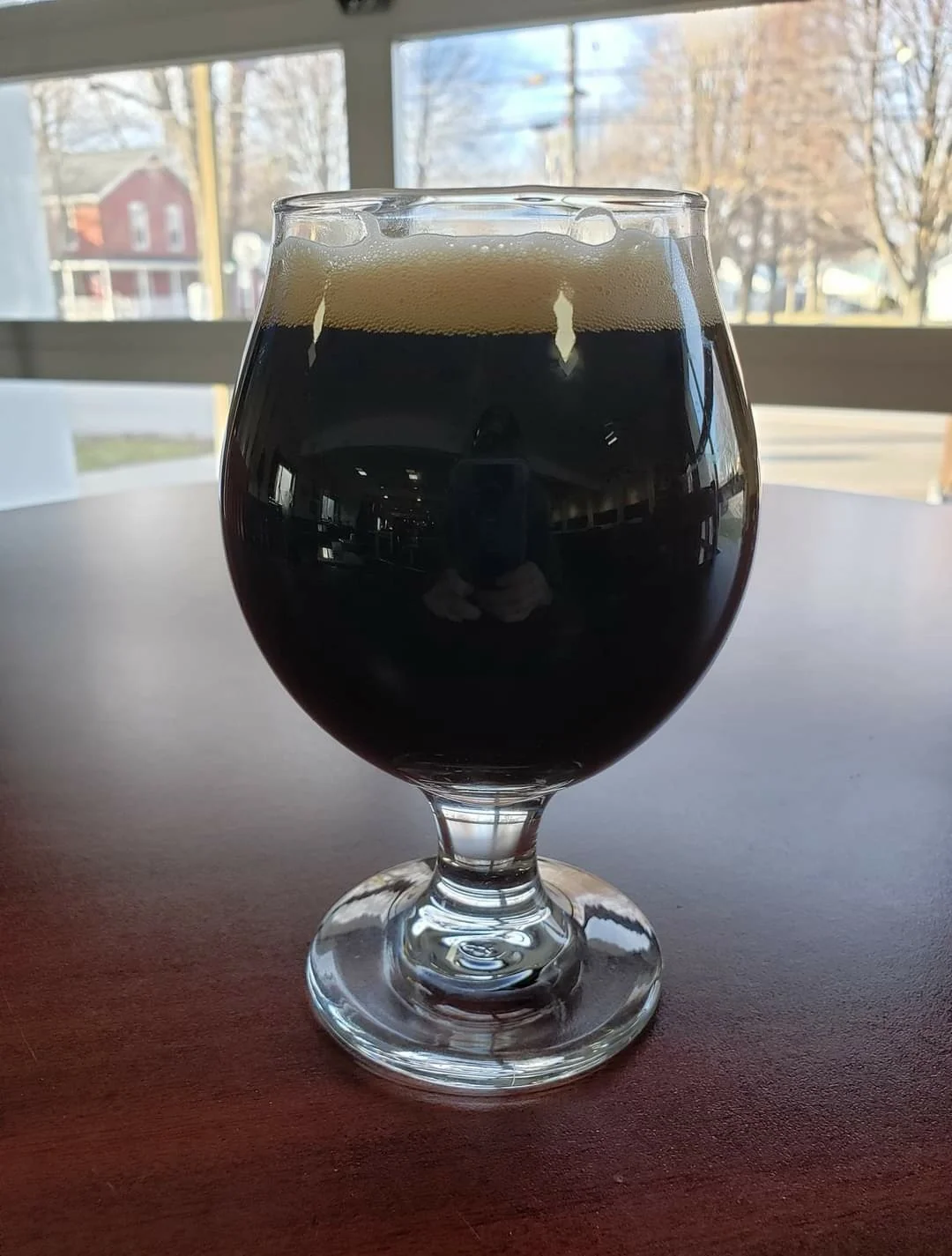 Dark beer on a wooden table
