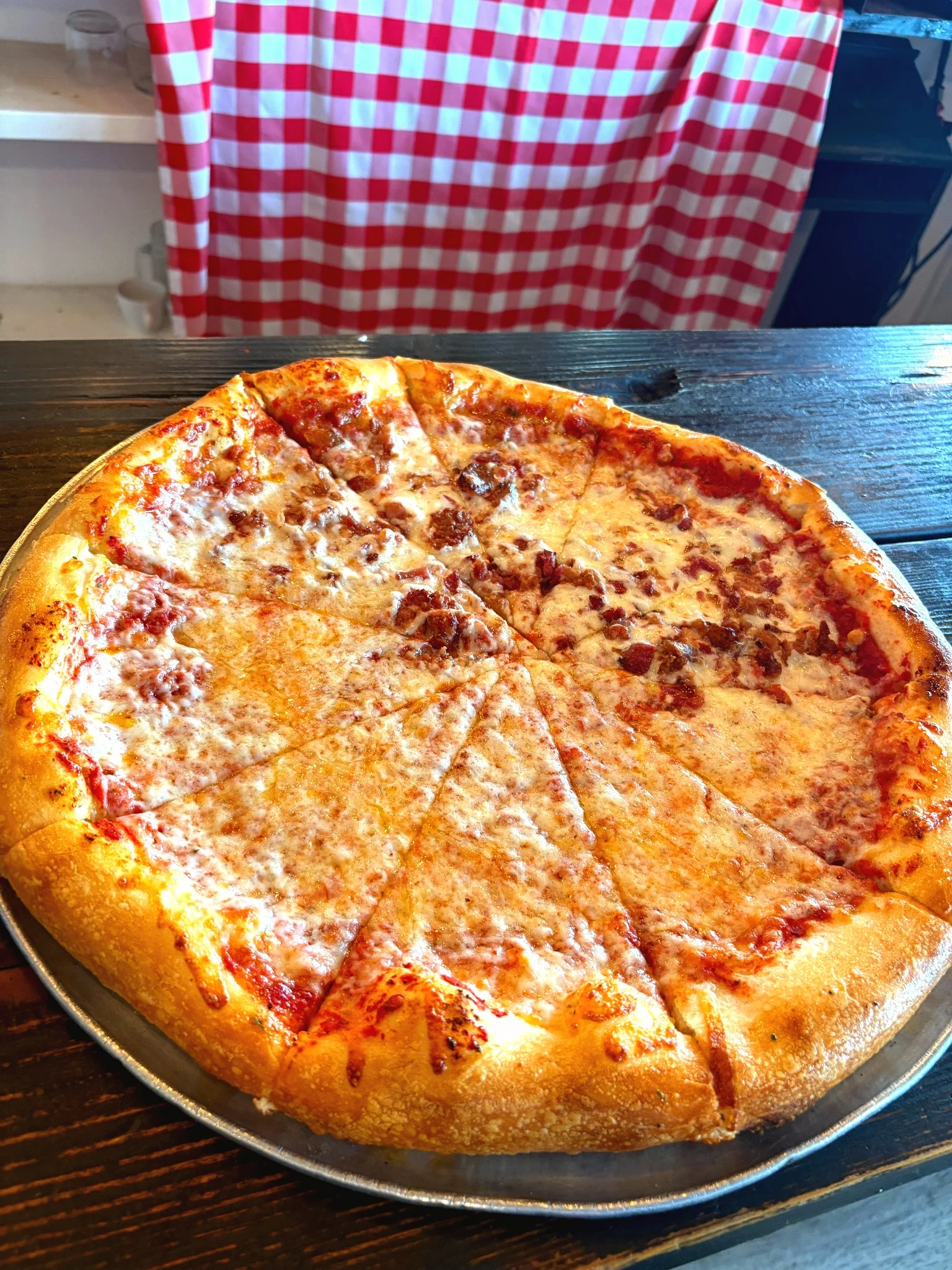 A colorful logo featuring a pizza slice with various toppings including pepperoni, vegetables, and herbs. The logo includes the text 'FV PIZZA D'Z' and a tagline that says 'a nice place to live & eat.'