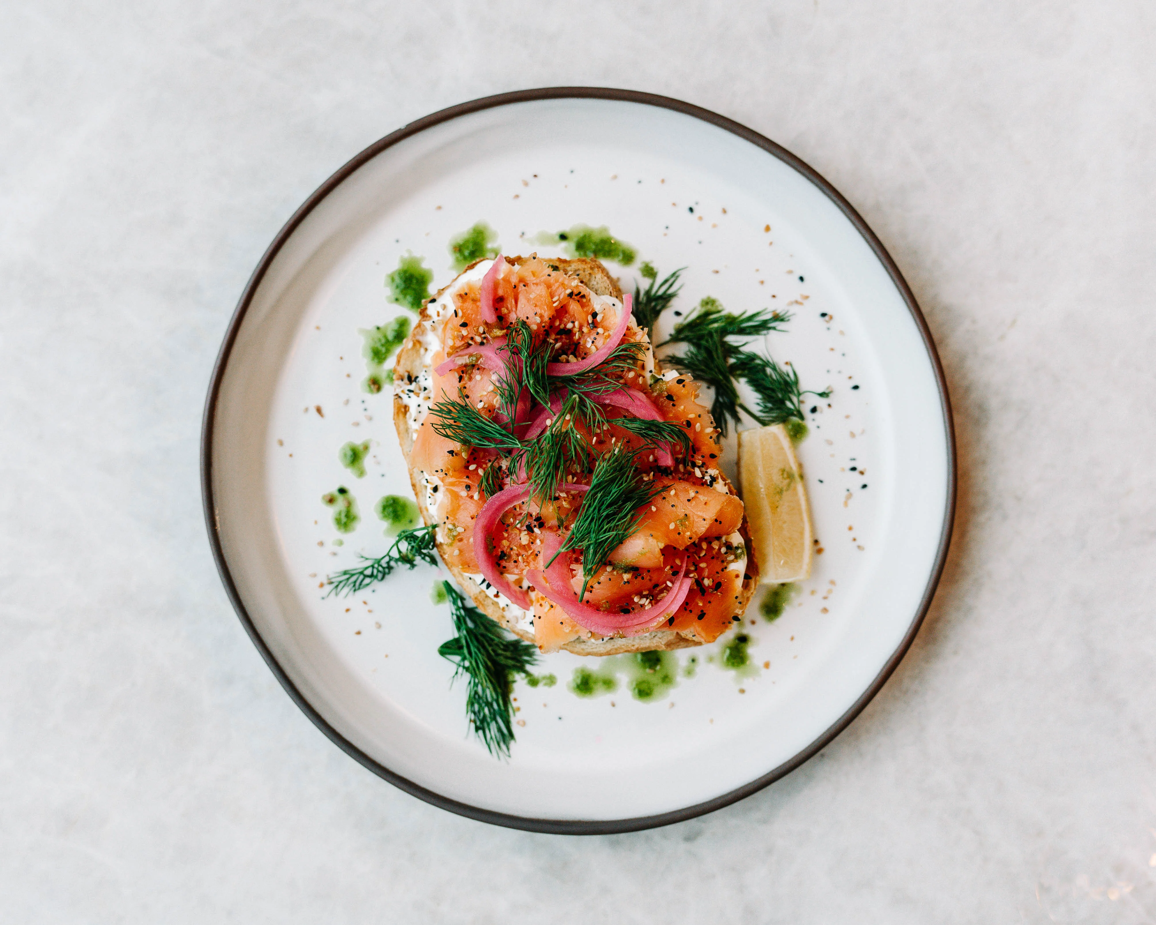 Smoked salmon on toast with dill and pickled onions