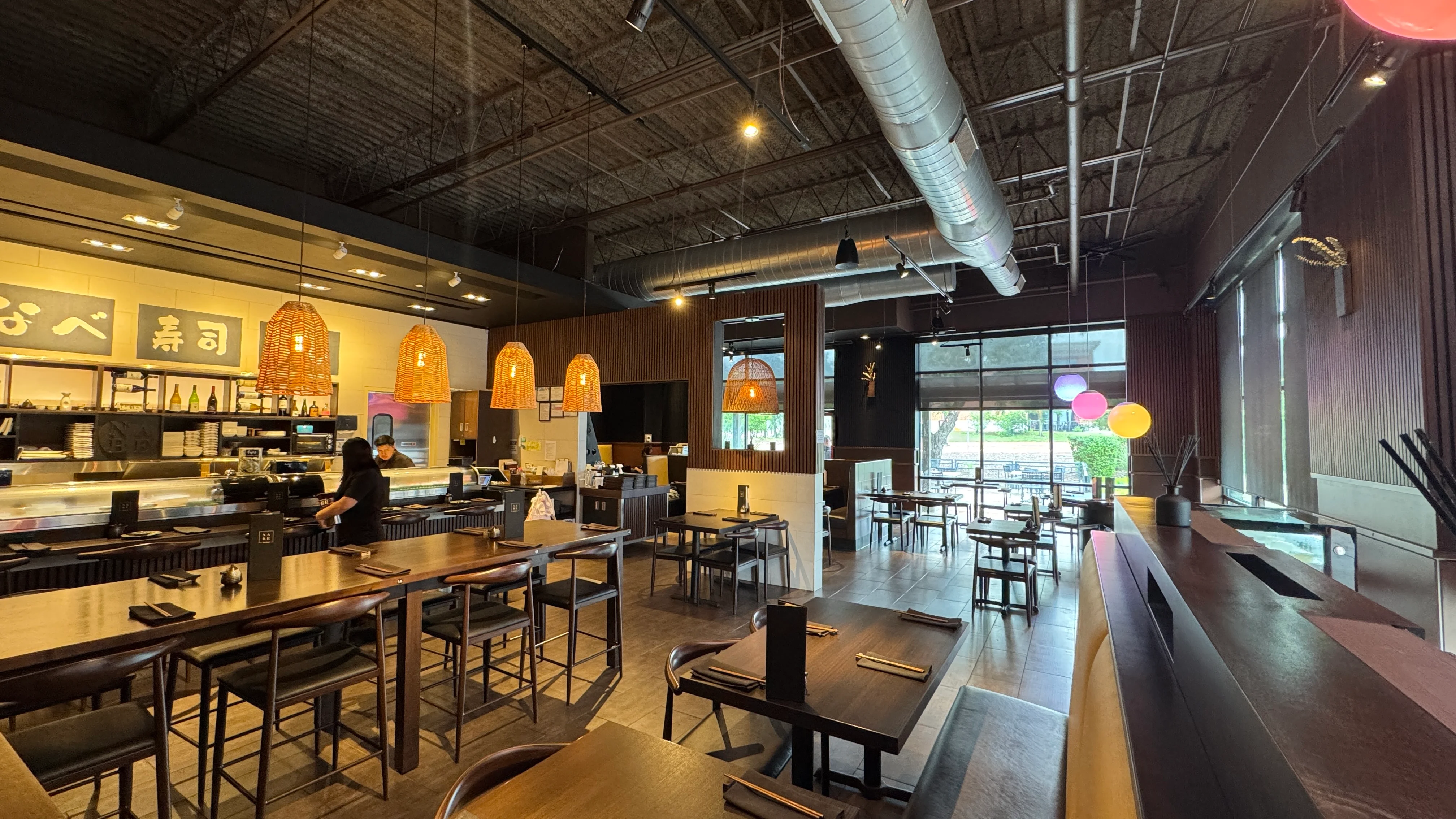 Modern Japanese sushi restaurant interior with warm lighting