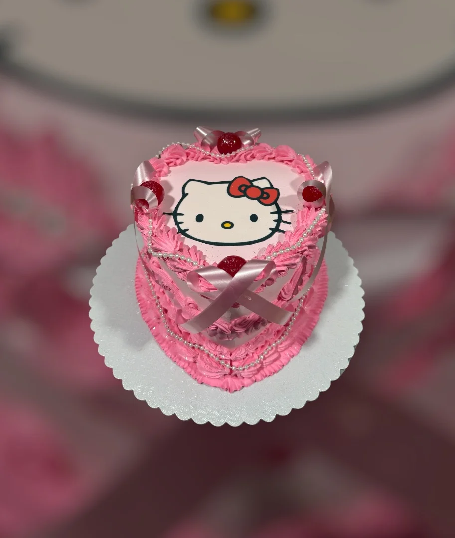 Cute Hello Kitty themed pink cake for celebrations