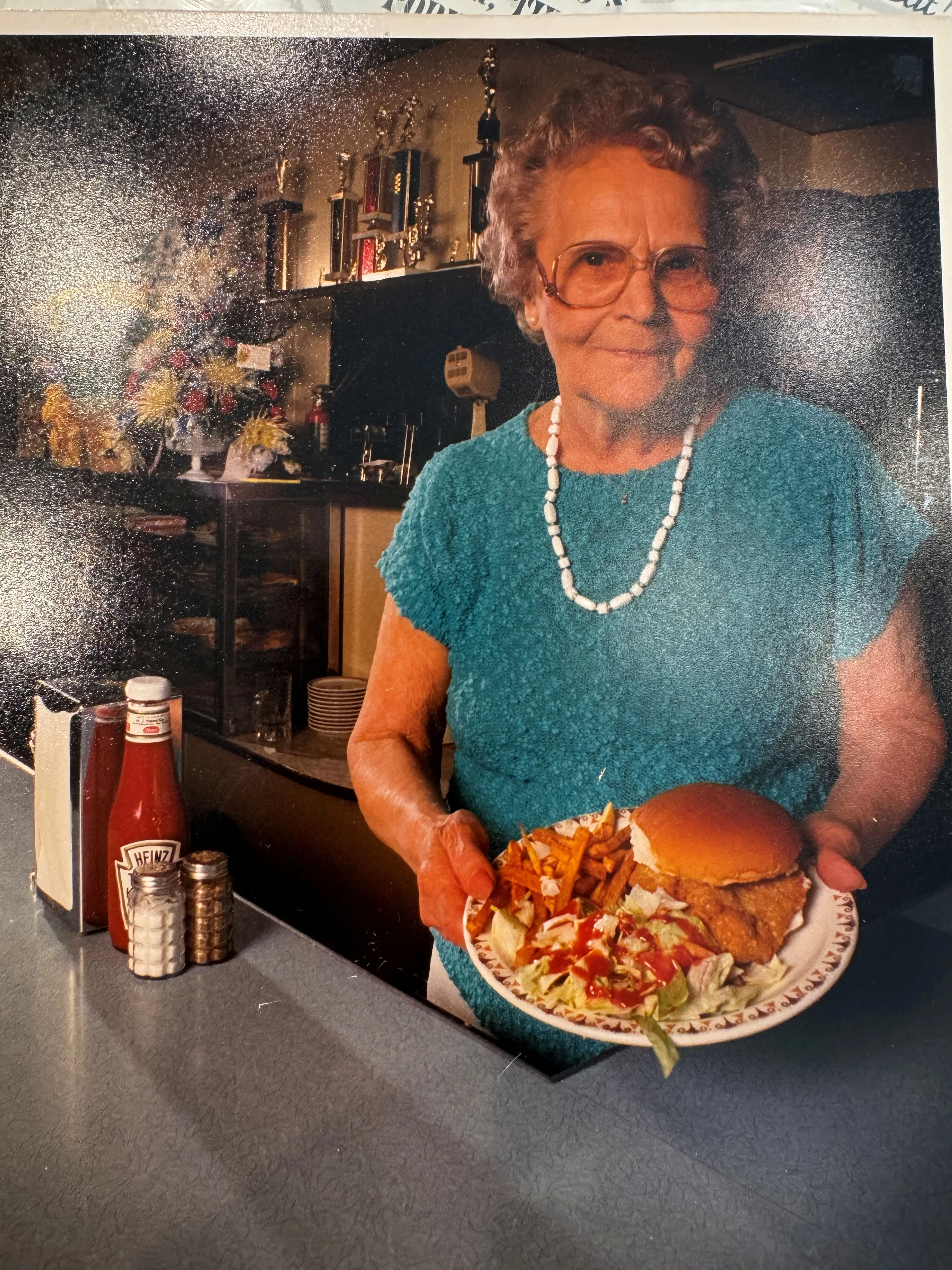 Momma Mazzorana with a plate of food. She is one of the original owners