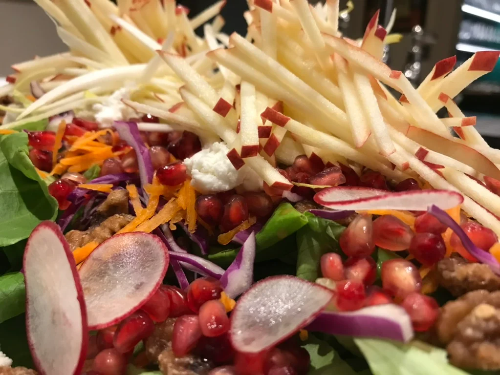 Colorful autumn salad with pomegranate and apple