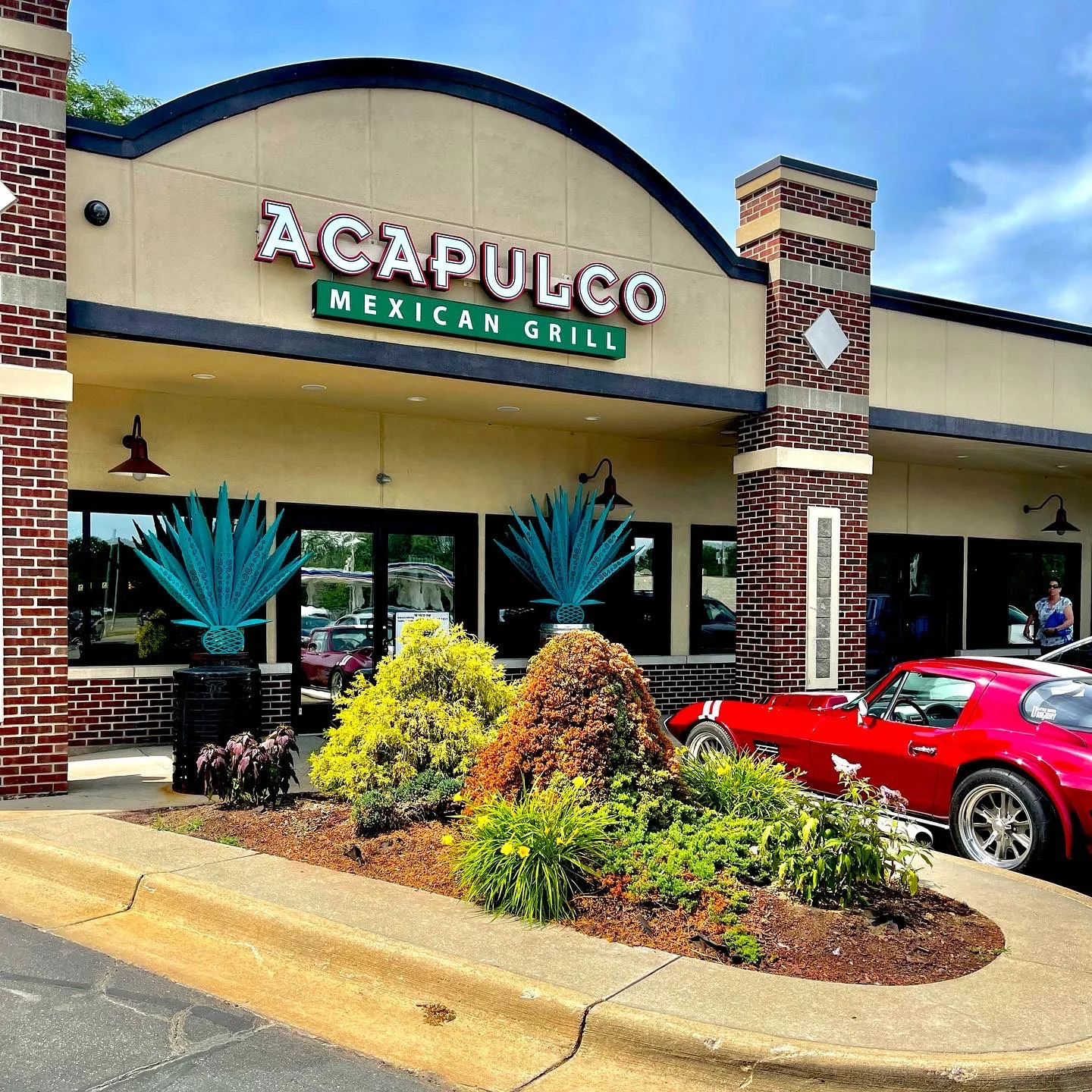 Exterior view of Acapulco Mexican Grill with vibrant decor