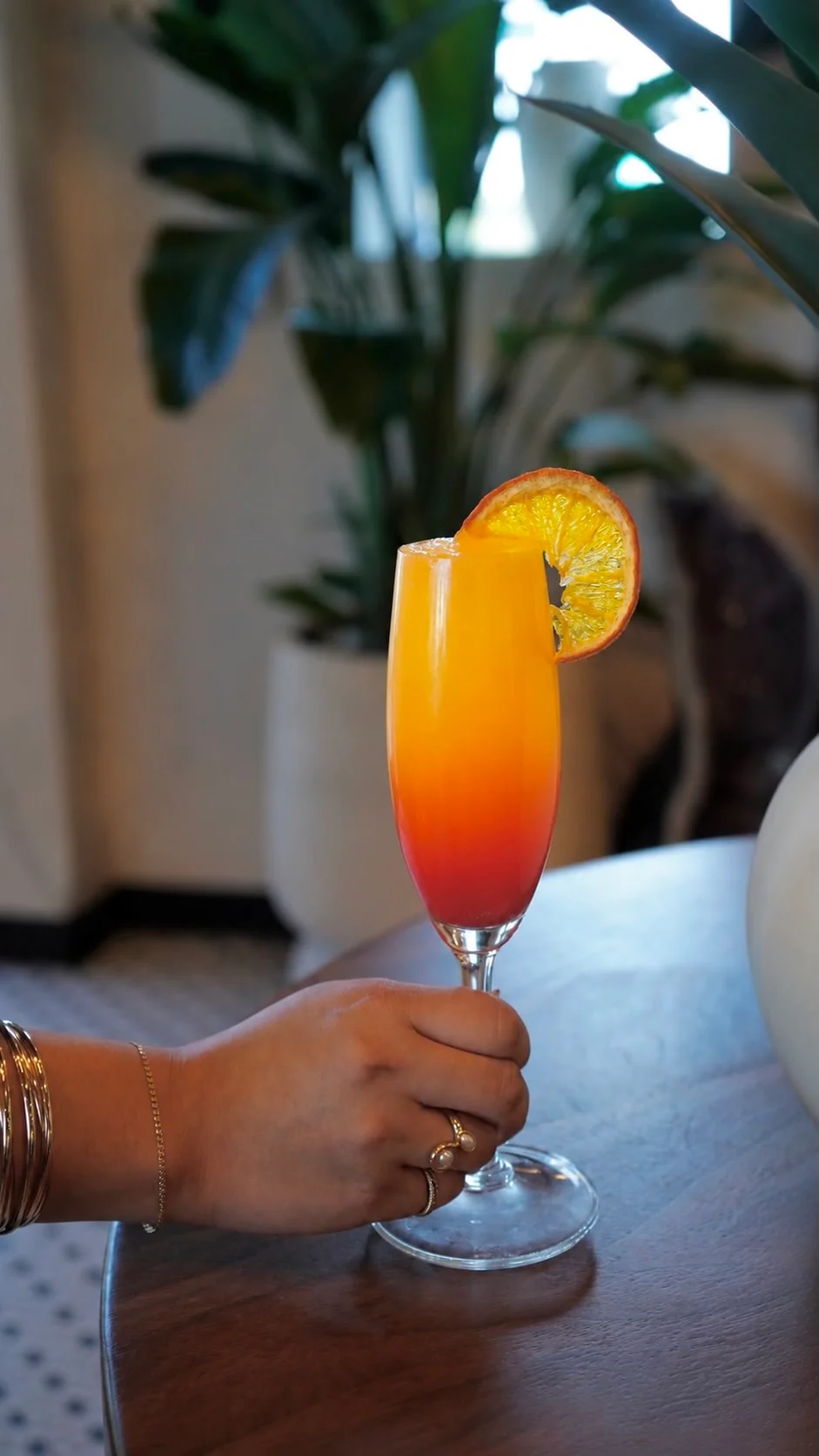 Vibrant tropical cocktail with orange and red gradient