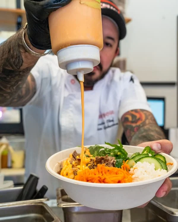 A restaurant chef preparing a dish