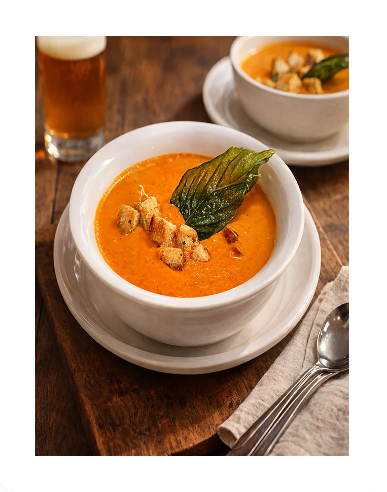 Creamy tomato basil soup with croutons