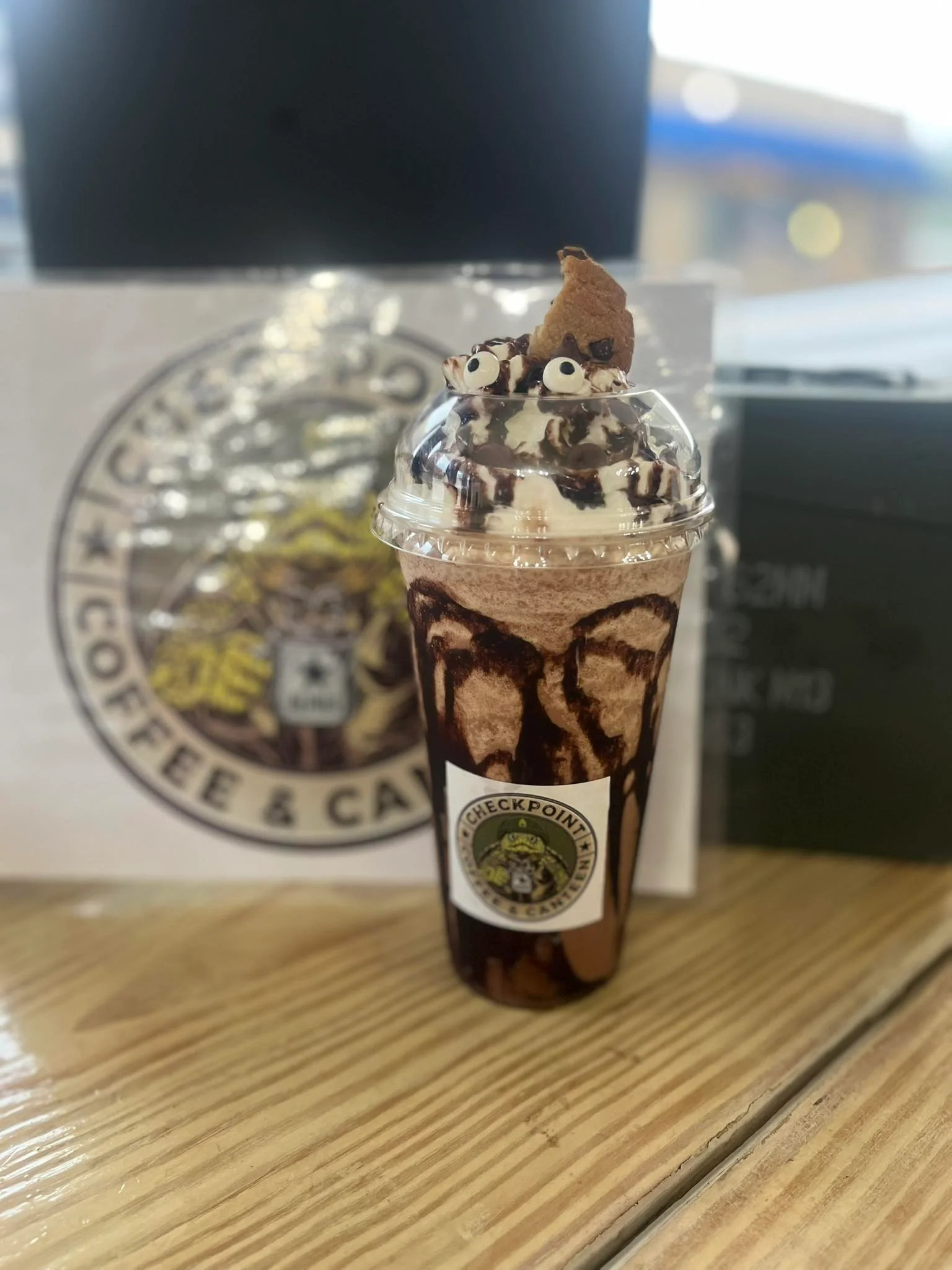 Decadent chocolate milkshake topped with whipped cream and cookie