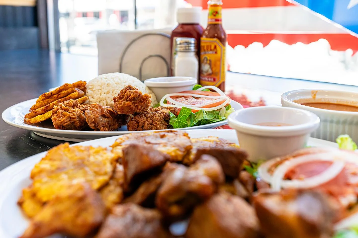 Cuban fried chicken with rice and tostones