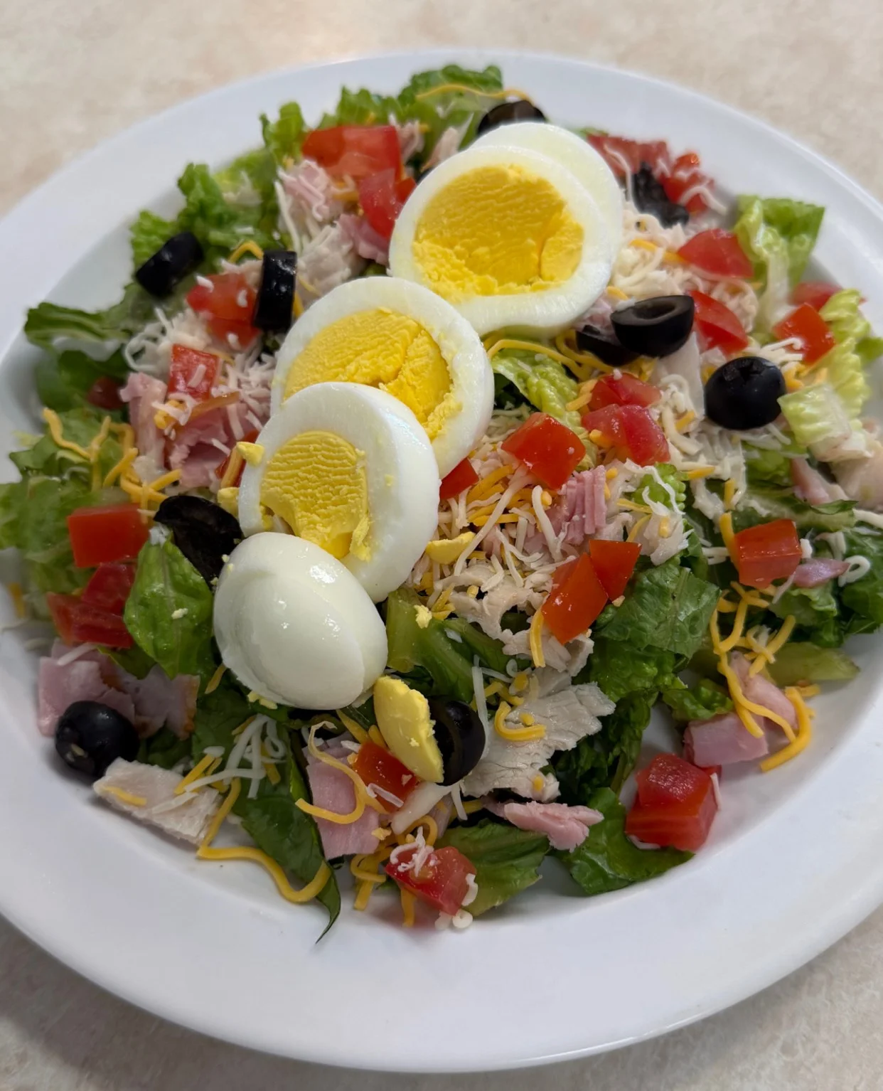 Classic American chef's salad with eggs and greens