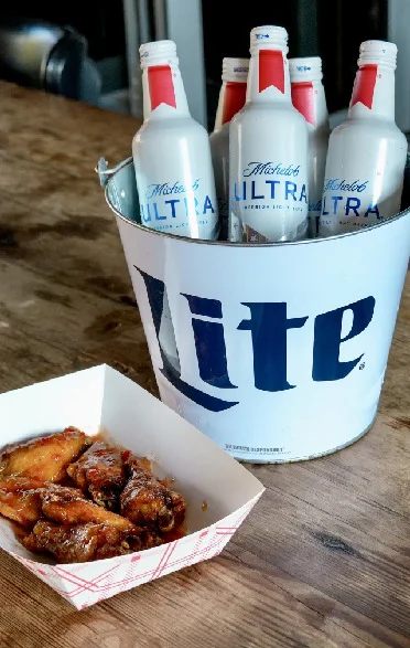 Savory chicken wings with beer in a rustic setting