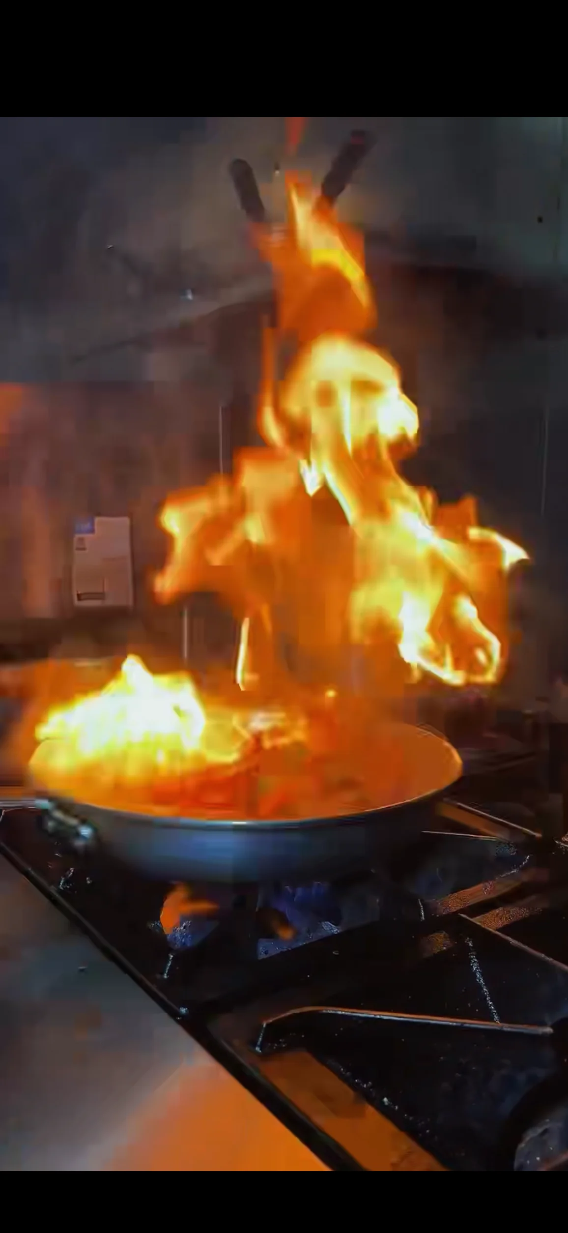 Flambé cooking technique in a professional kitchen