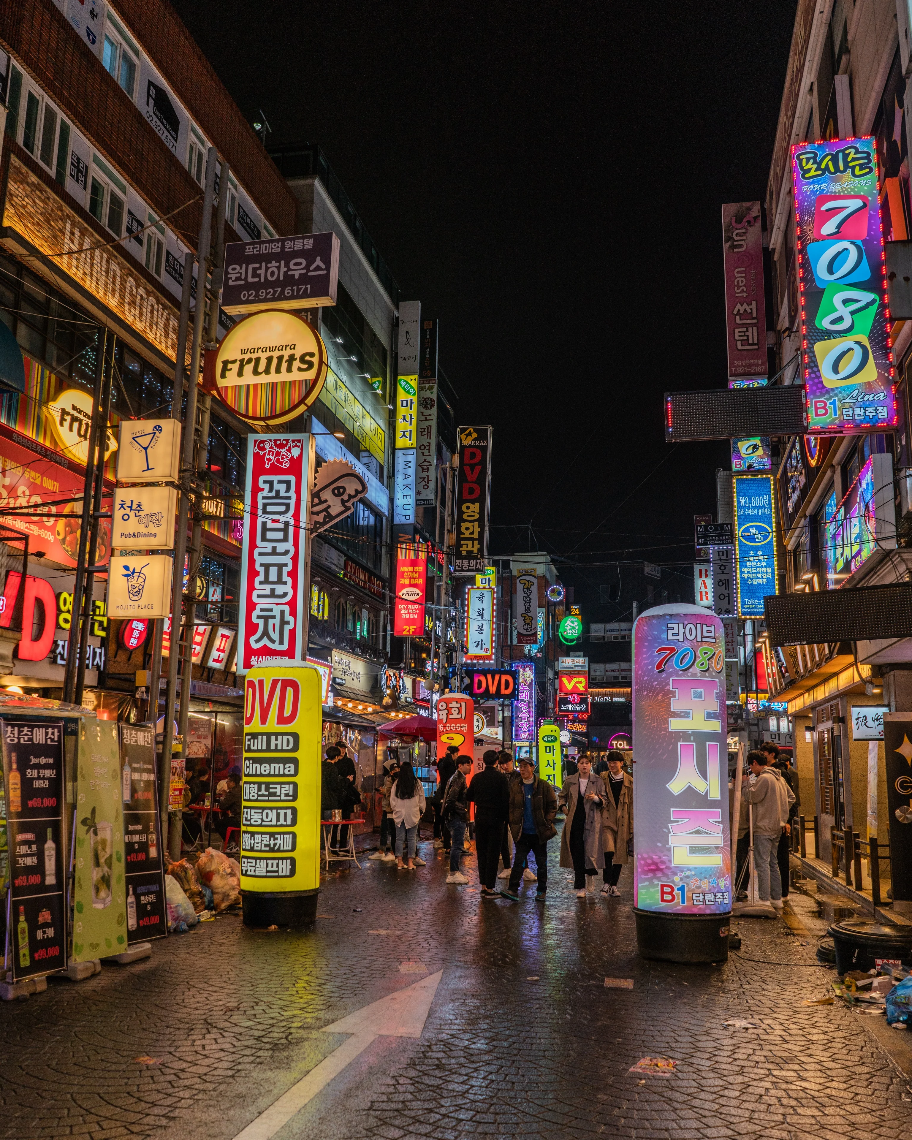 Vibrant street scene in Korea with neon signs at night