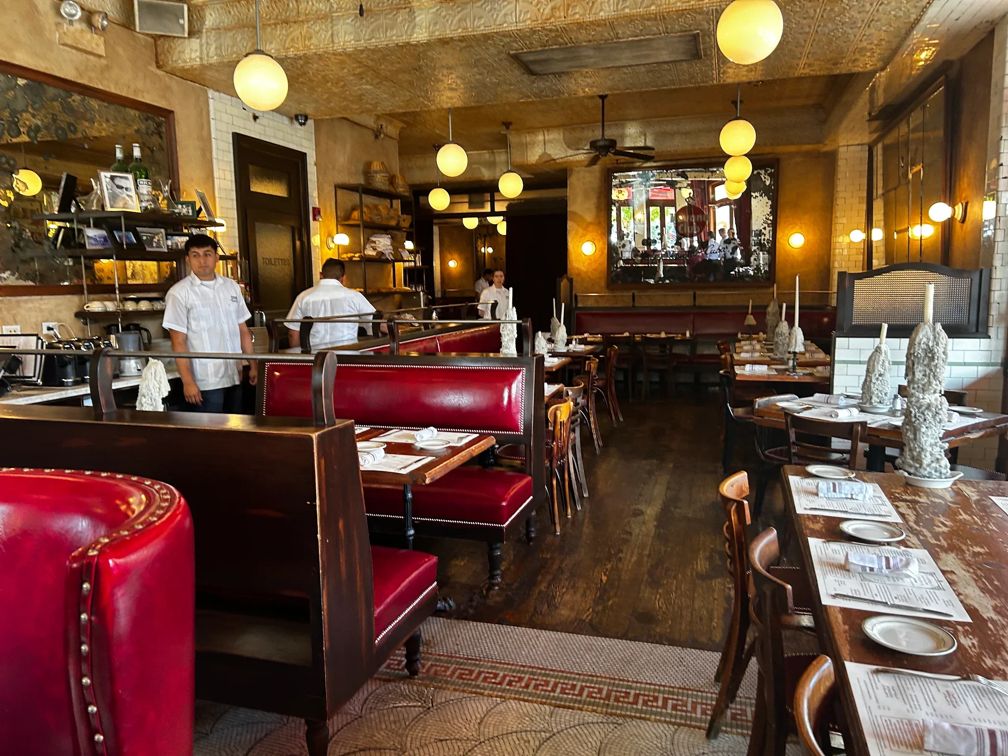 Charming restaurant interior with red booths and warm lighting