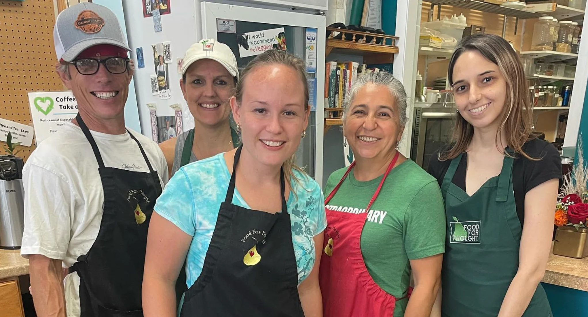 Friendly team at a community kitchen preparing meals together