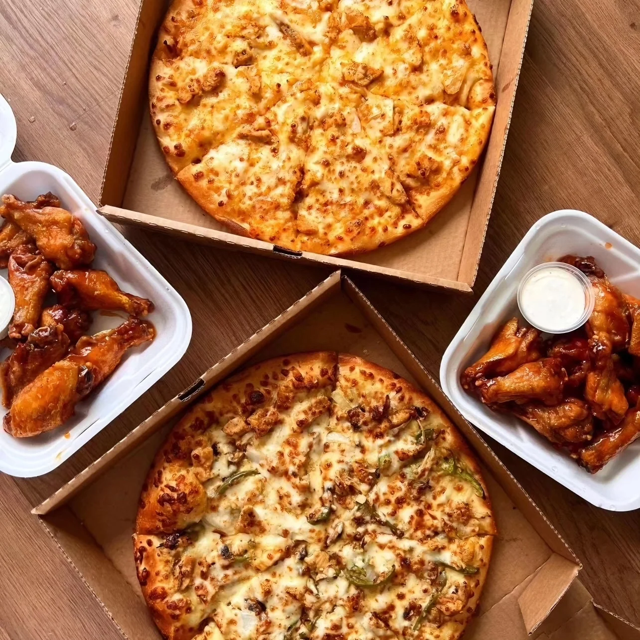 Delicious pizza and chicken wings for a casual meal