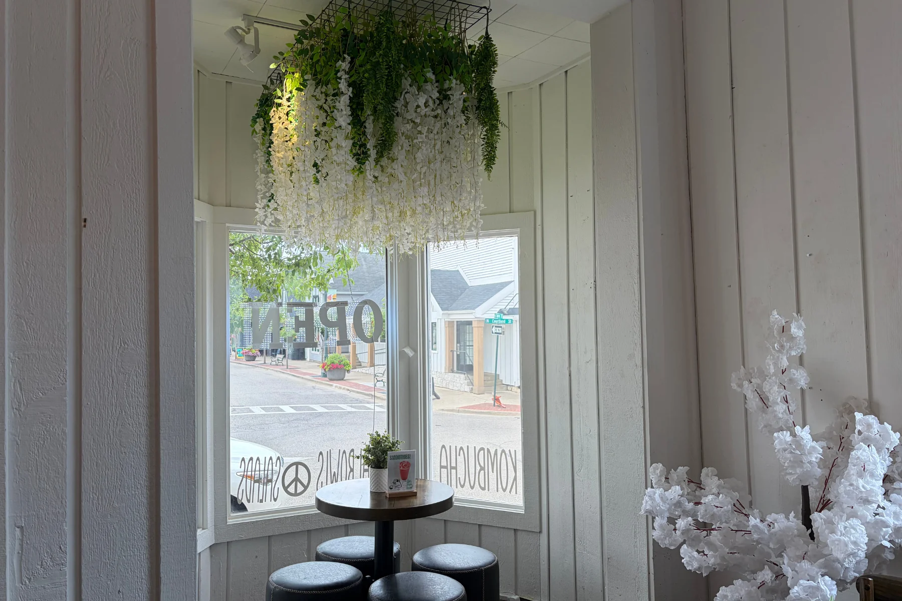 Cozy restaurant interior with floral decor and seating area