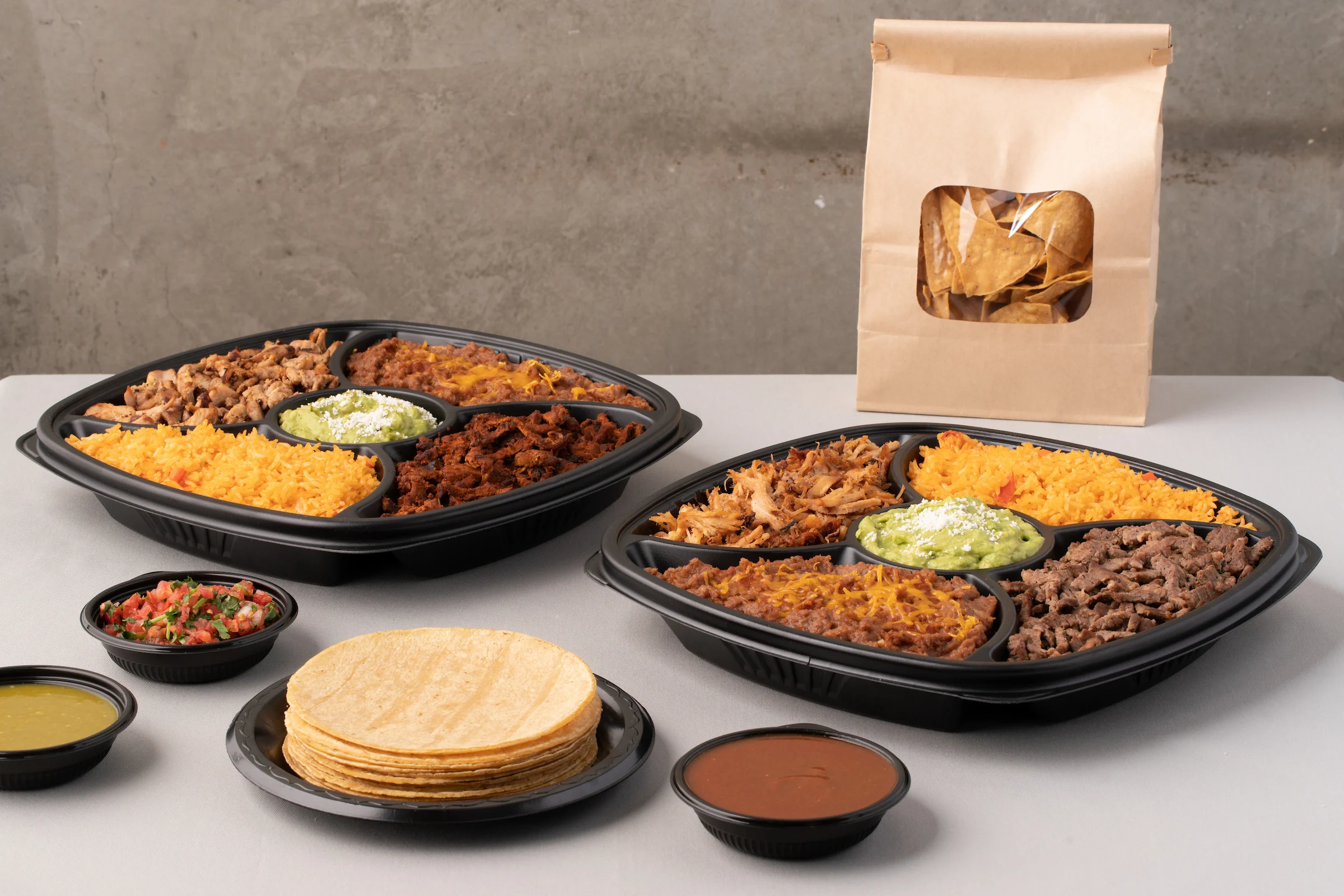Mexican fiesta platter with rice, meats, and tortillas