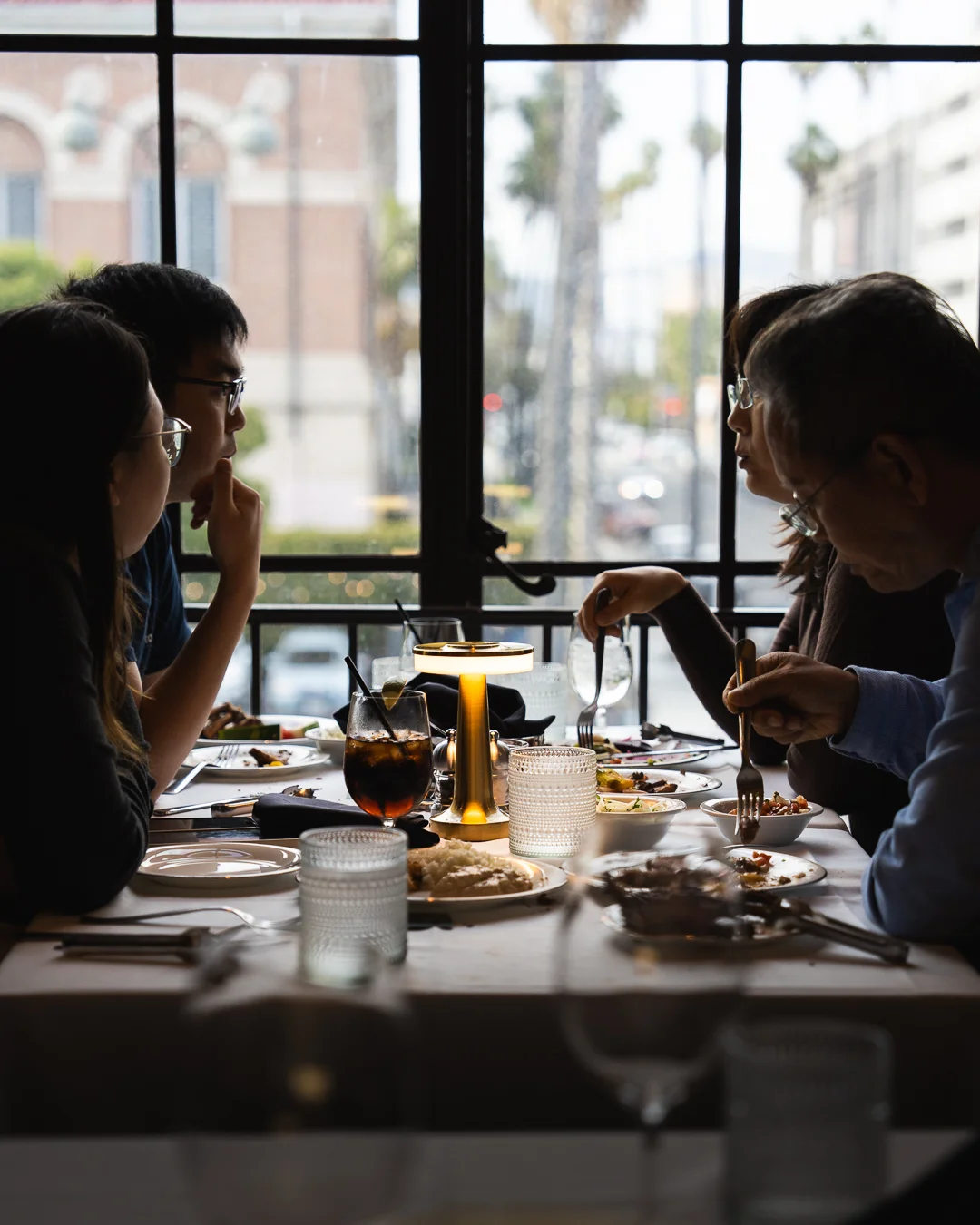 Cozy restaurant dining scene with friends enjoying a meal together