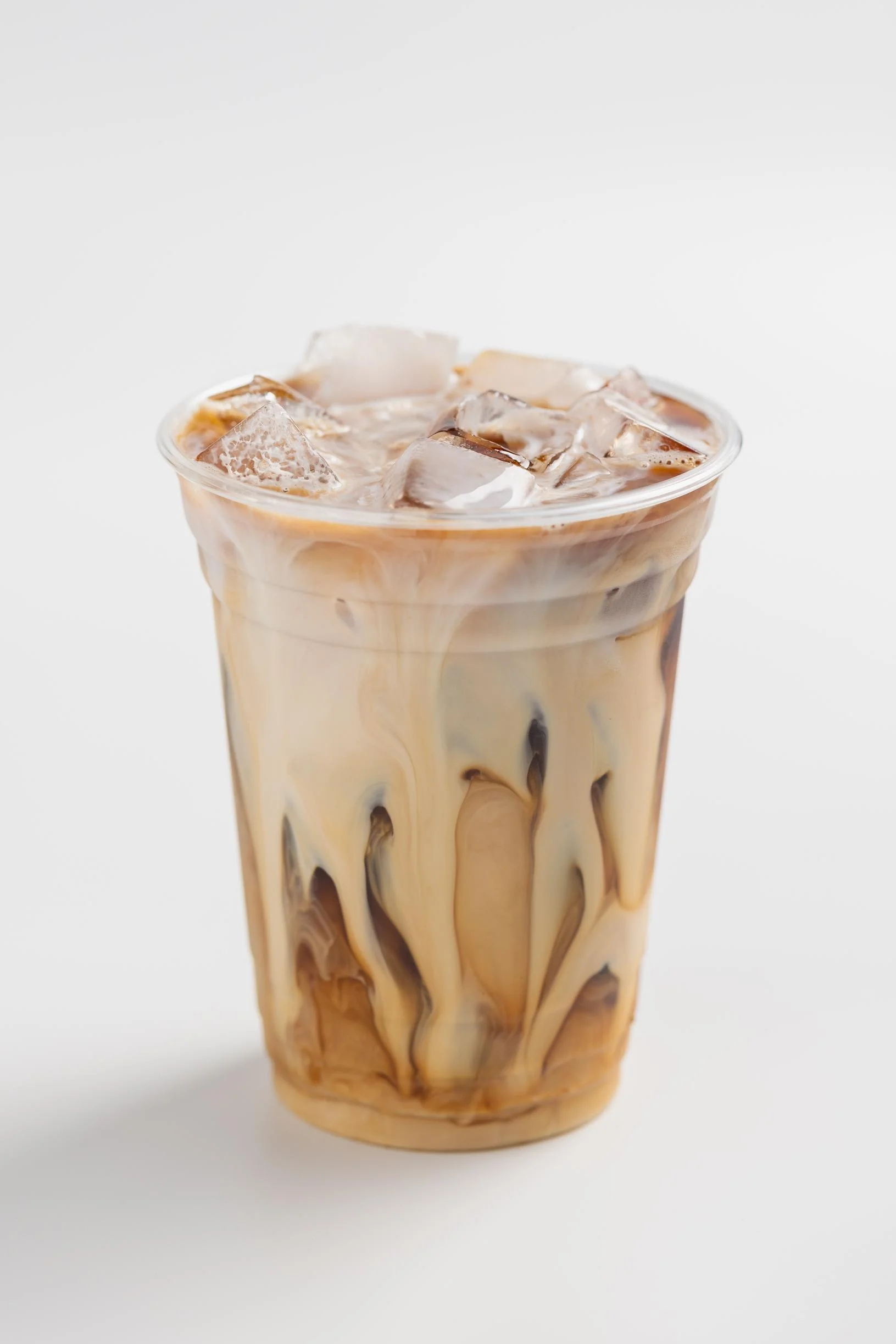Iced coffee with milk and ice cubes