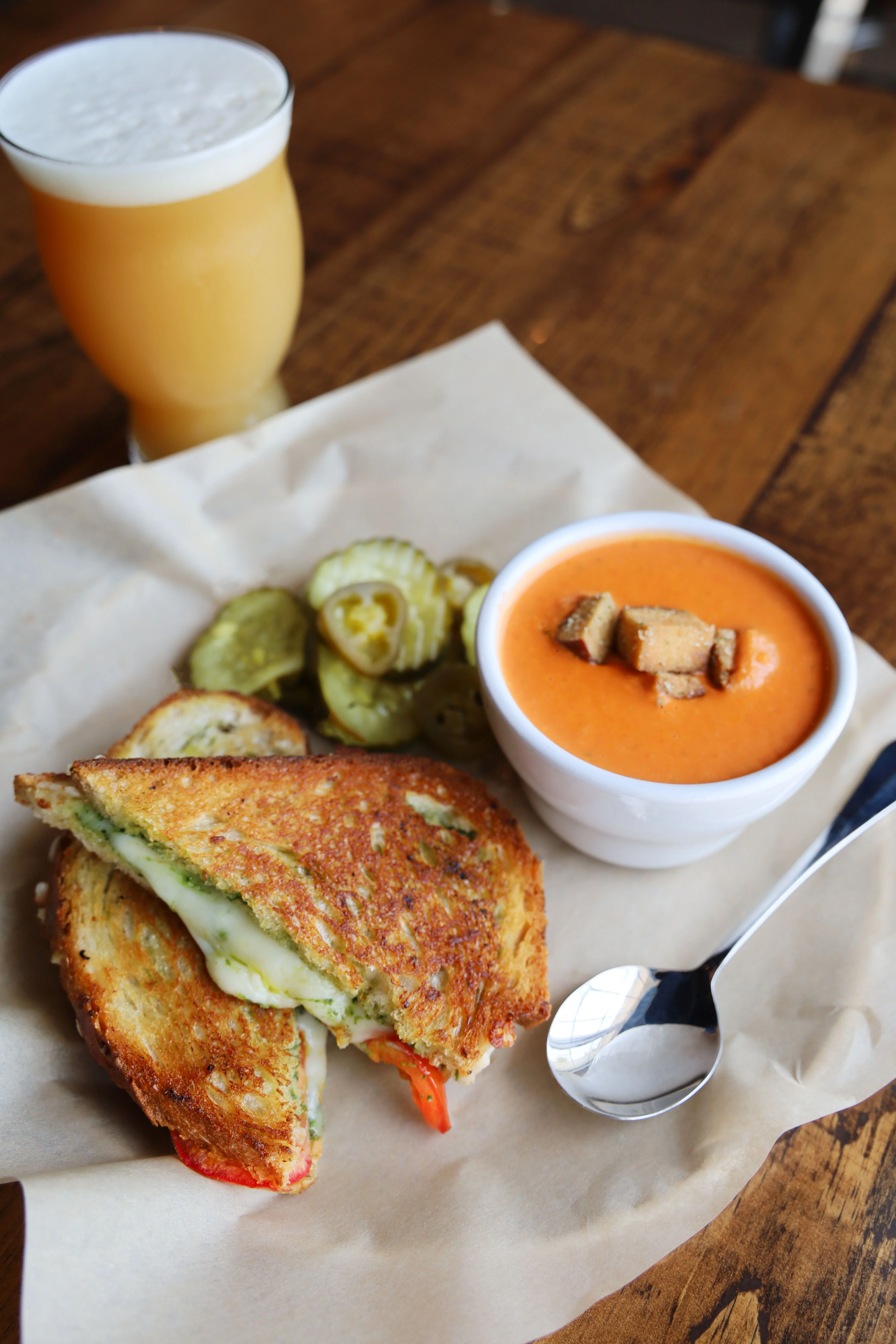 Grilled cheese sandwich with tomato soup and pickles