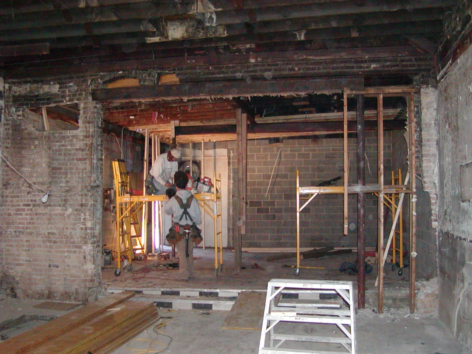Construction site with workers renovating a restaurant interior