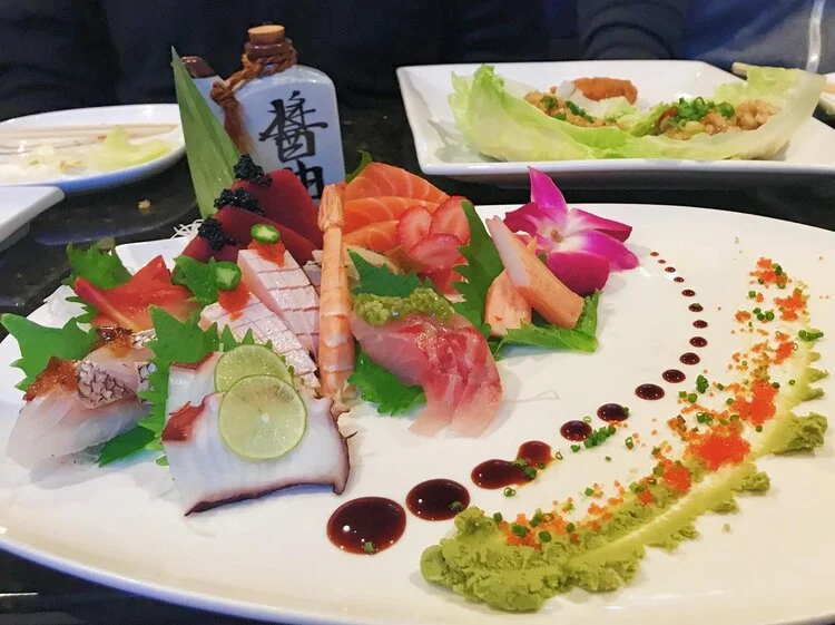 Artfully arranged Japanese sashimi platter with fresh seafood