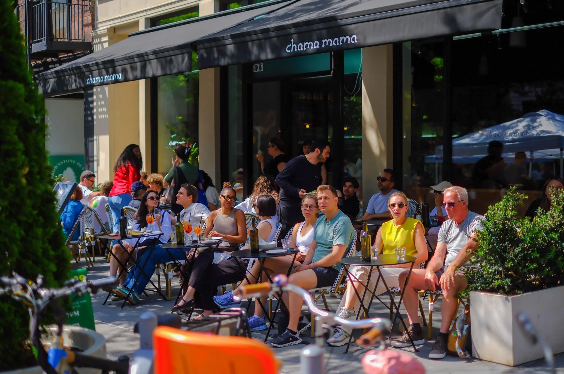 Weekend brunch crowd outside Chama Mama Brooklyn Heights on Montague Street