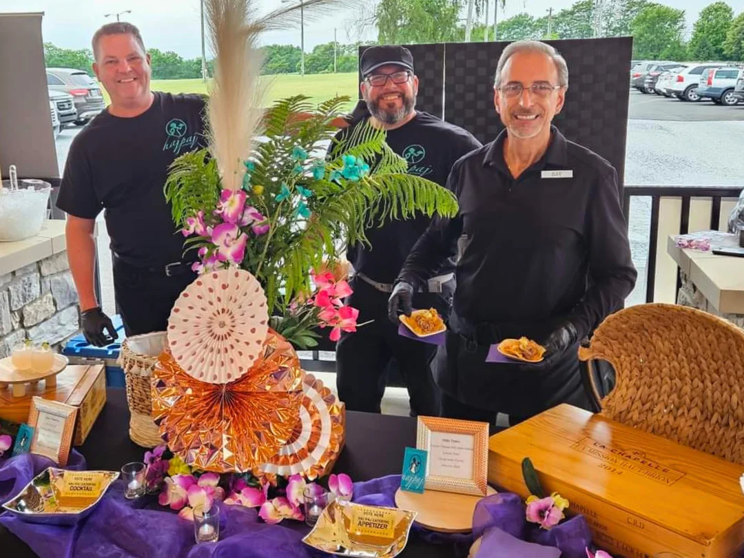 Catering team presenting appetizers at an outdoor event