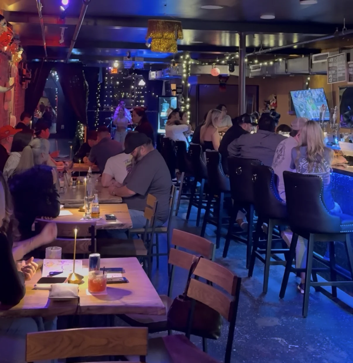 Vibrant restaurant interior with lively atmosphere and bar seating