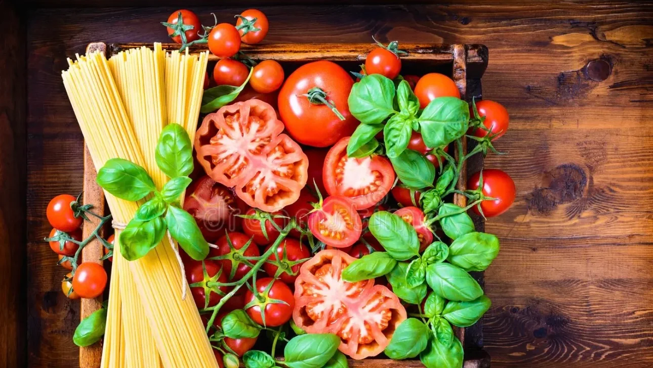 Fresh ingredients for Italian pasta dish with tomatoes and basil