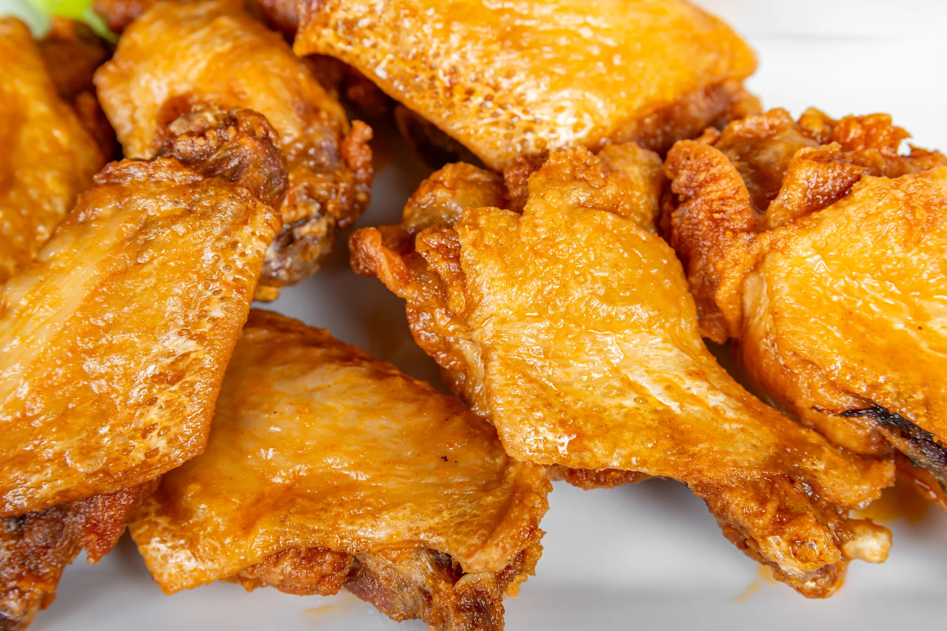 Delicious chicken wings served with dipping sauce on a wooden table.