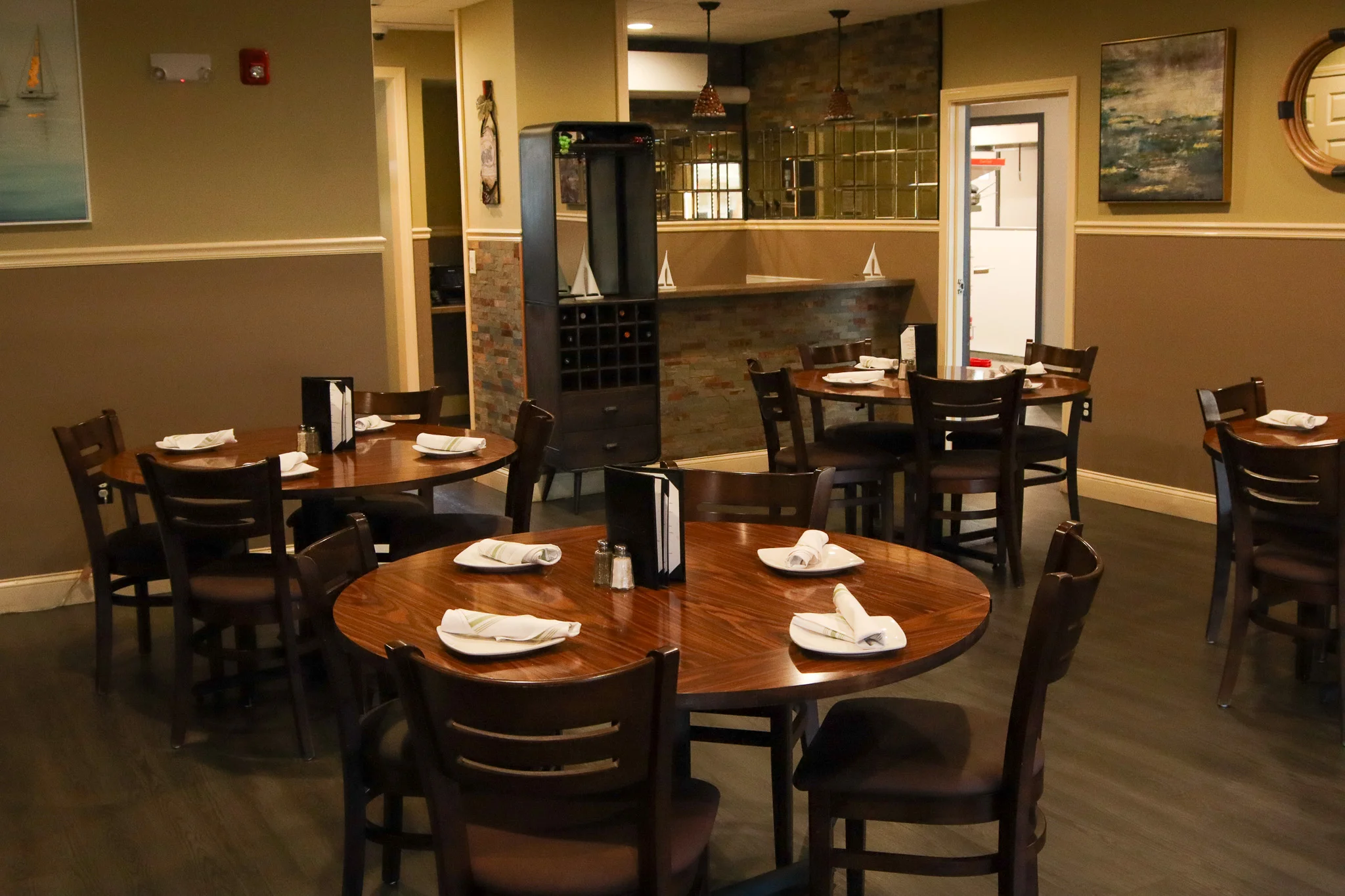 Cozy restaurant interior with wooden tables and warm lighting