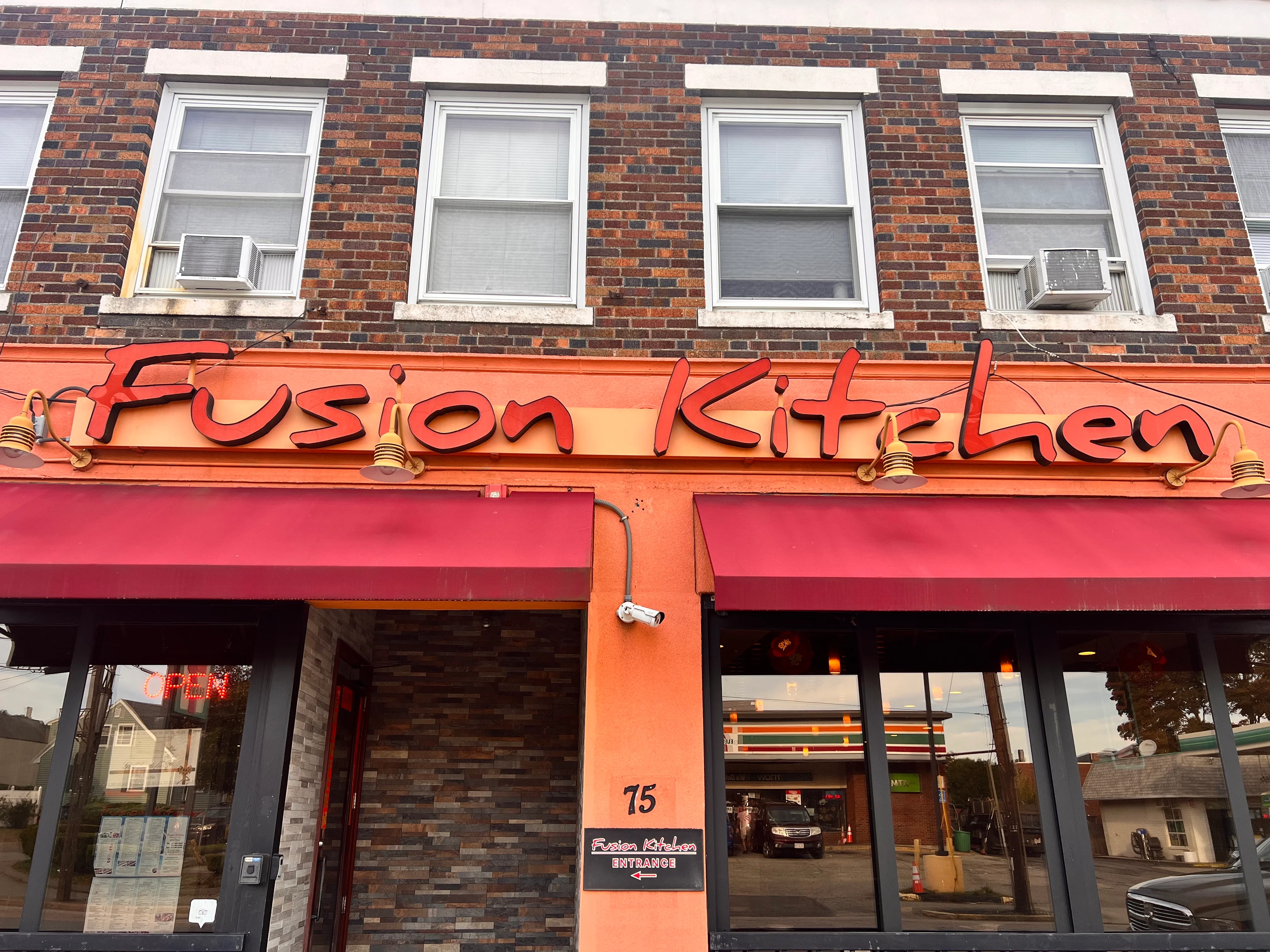 Exterior view of Fusion Kitchen restaurant with vibrant signage