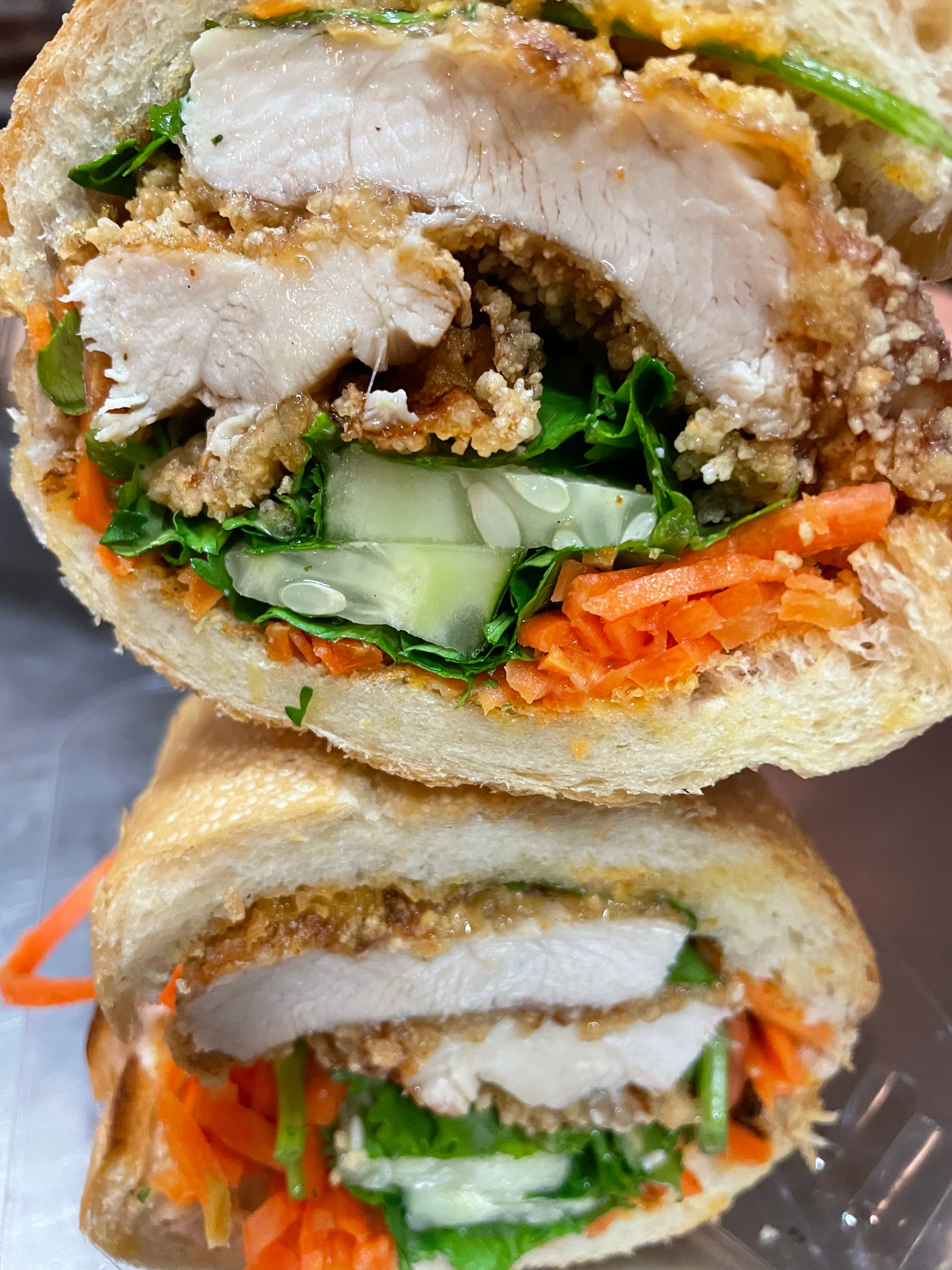 Vietnamese bánh mì sandwich with crispy chicken and fresh vegetables