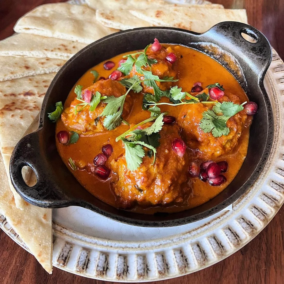 Indian kofta curry served with naan bread