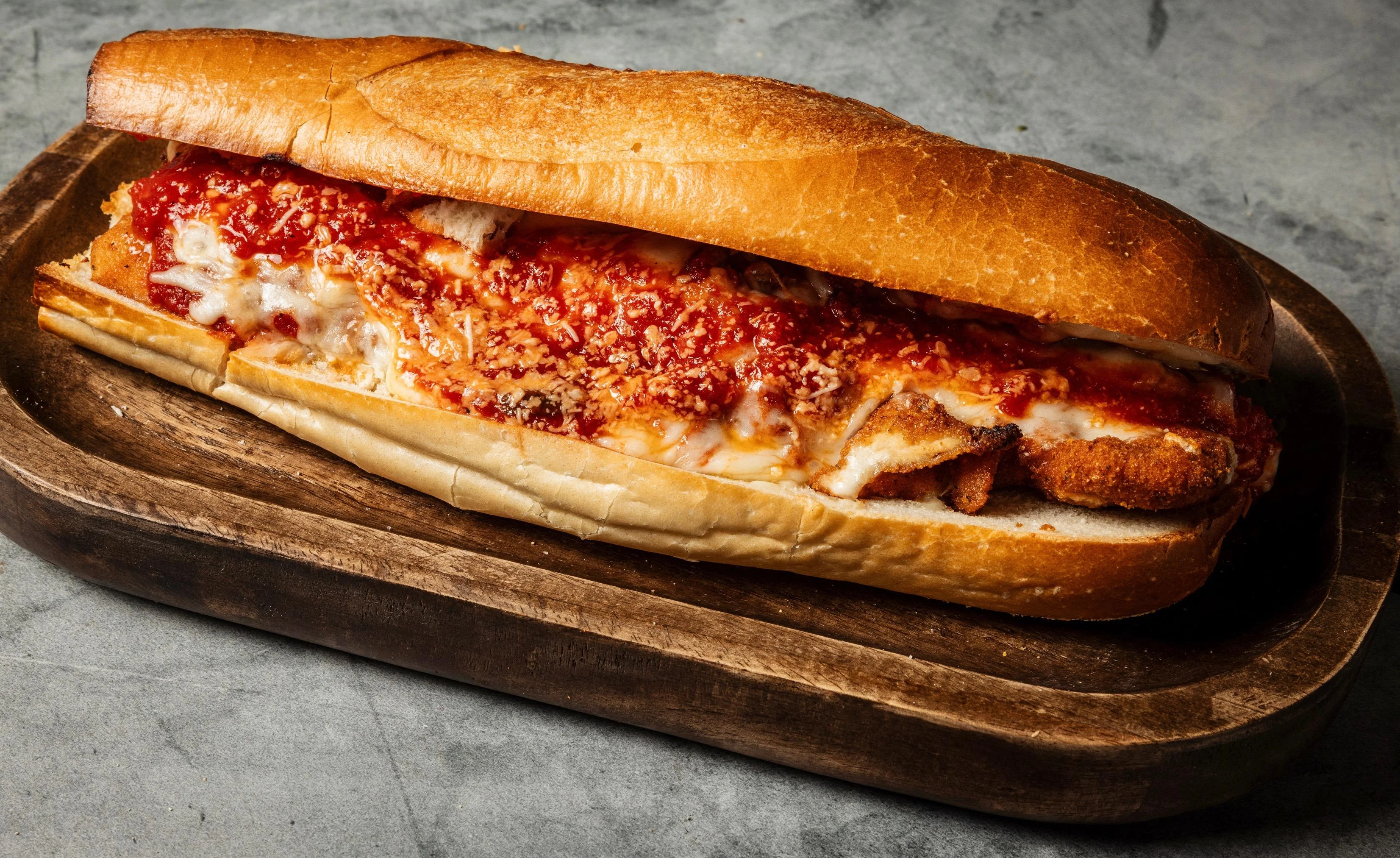 Chicken parm hero on Italian bread