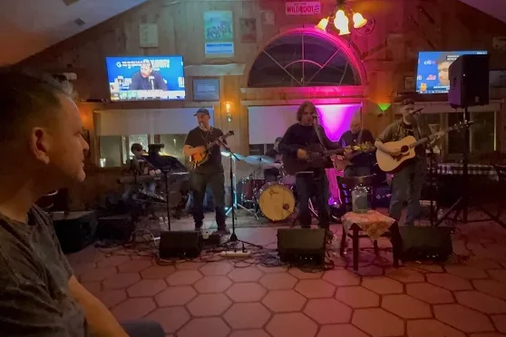 Live band performing at a restaurant event with vibrant atmosphere.