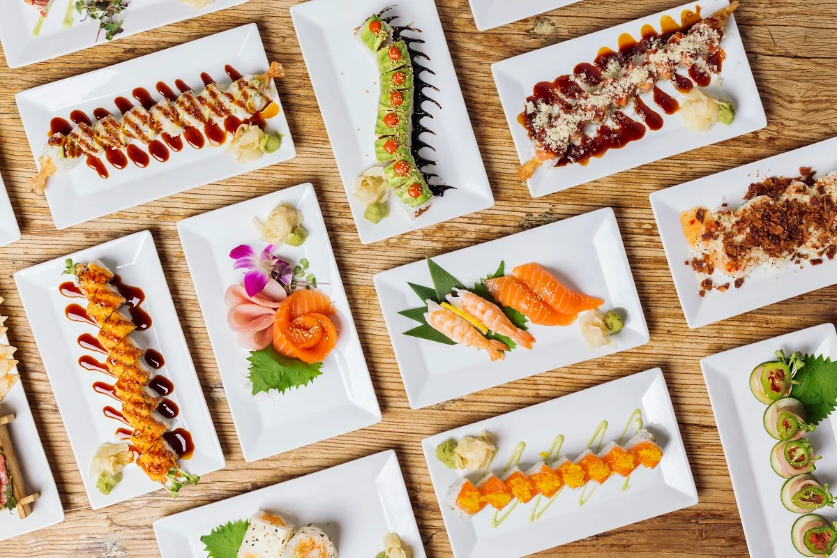 Assorted Japanese sushi platters with fresh seafood and garnishes