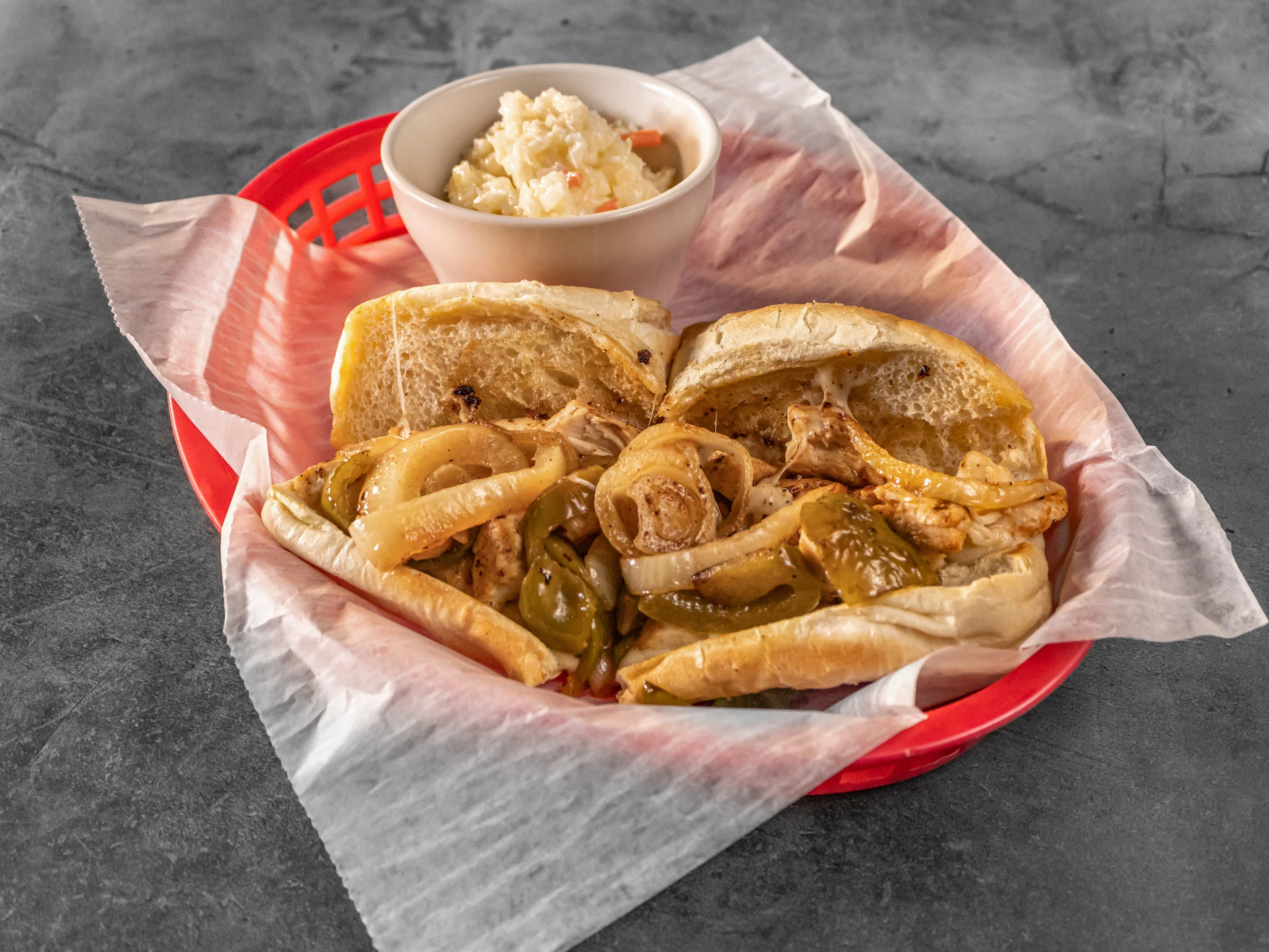 Italian chicken cheesesteak sandwich with peppers and onions
